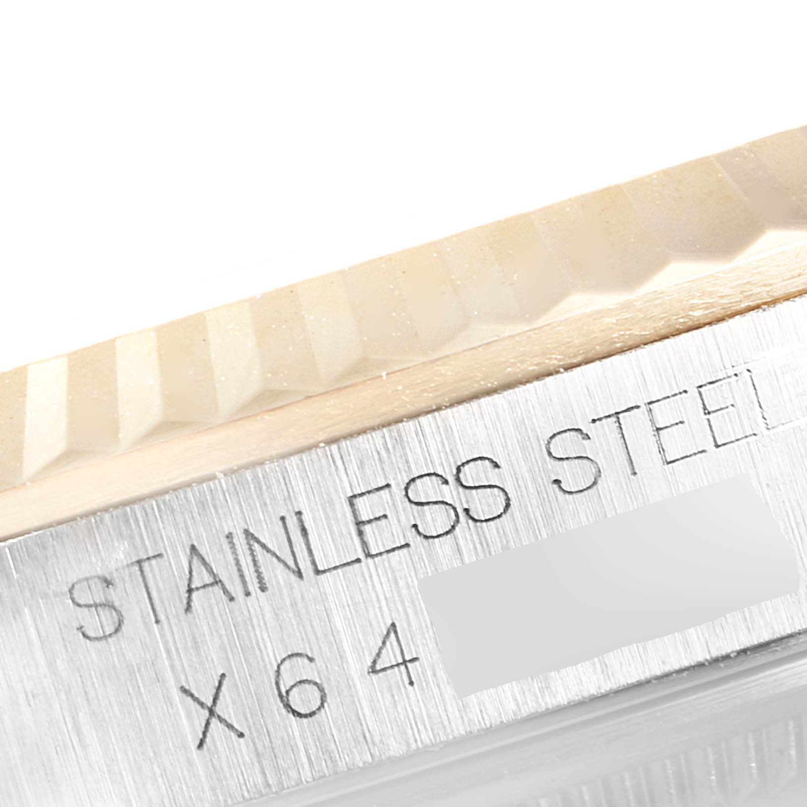 The image shows a close-up of the case and fluted bezel of a Rolex Datejust 16233 Men's Steel and Gold (two tone) Black Dial 16233 Men's Steel and Gold (two tone) Black Dial watch, highlighting the "STAINLESS STEEL" engraving.