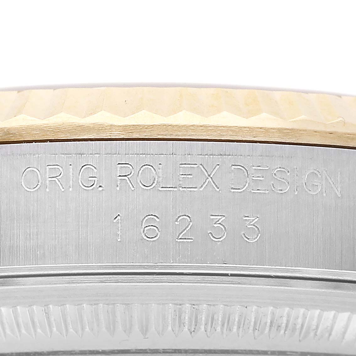 The image shows a close-up of the case side of a Rolex Datejust 116233 Men's Steel and Gold (two tone) Champagne Dial, highlighting the model number and engraved inscriptions.