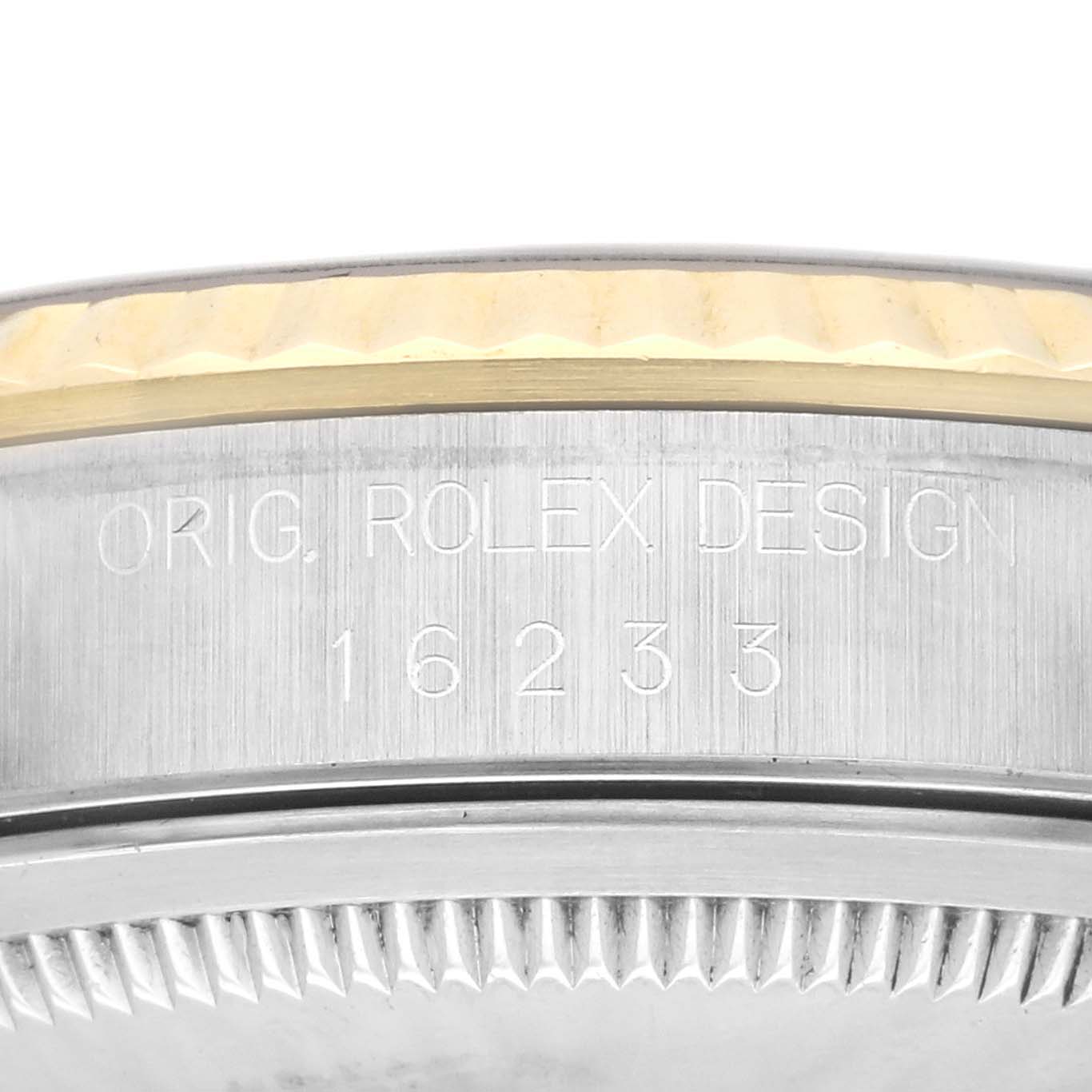 This image shows a close-up of the case side of a Rolex Datejust 16233 Men's Stainless Steel Champagne Dial 16233 Men's Stainless Steel Champagne Dial, featuring engraving with the model number 16233.