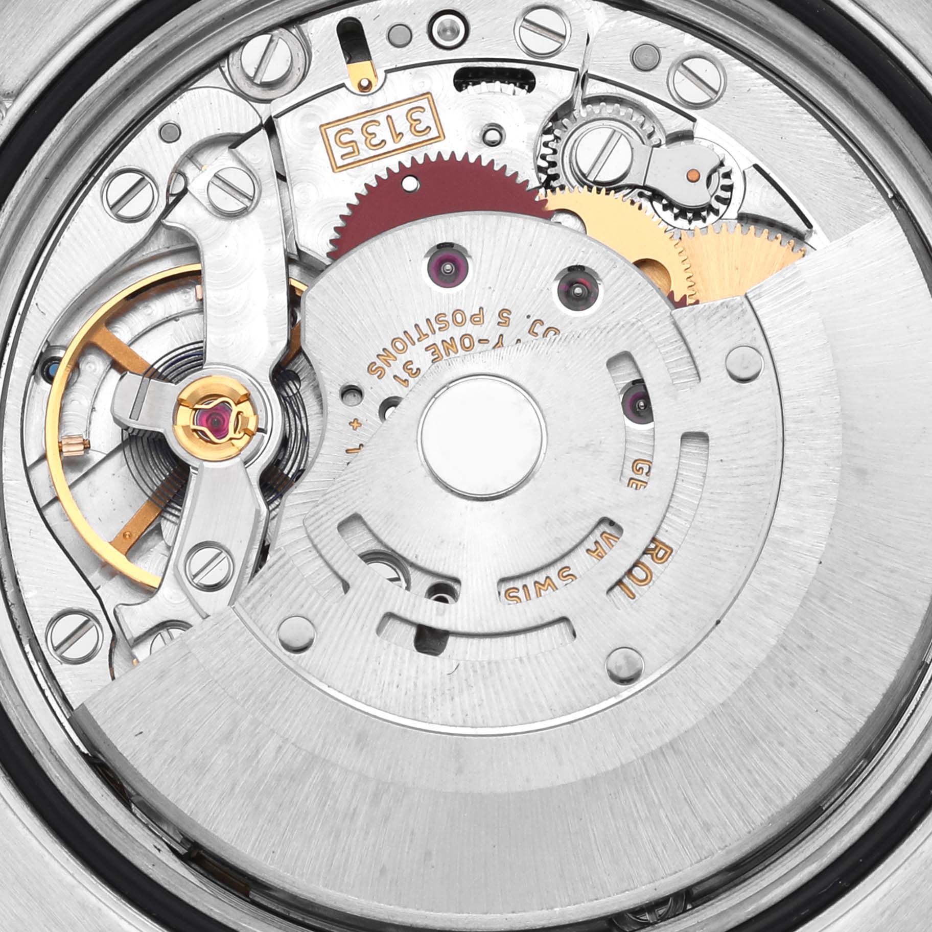 This image shows the intricate inner workings of a Rolex Datejust 116243 Men's Steel and Gold (two tone) Mother of Pearl Dial 116243 Men's Steel and Gold (two tone) Mother of Pearl Dial watch movement from a close-up angle.