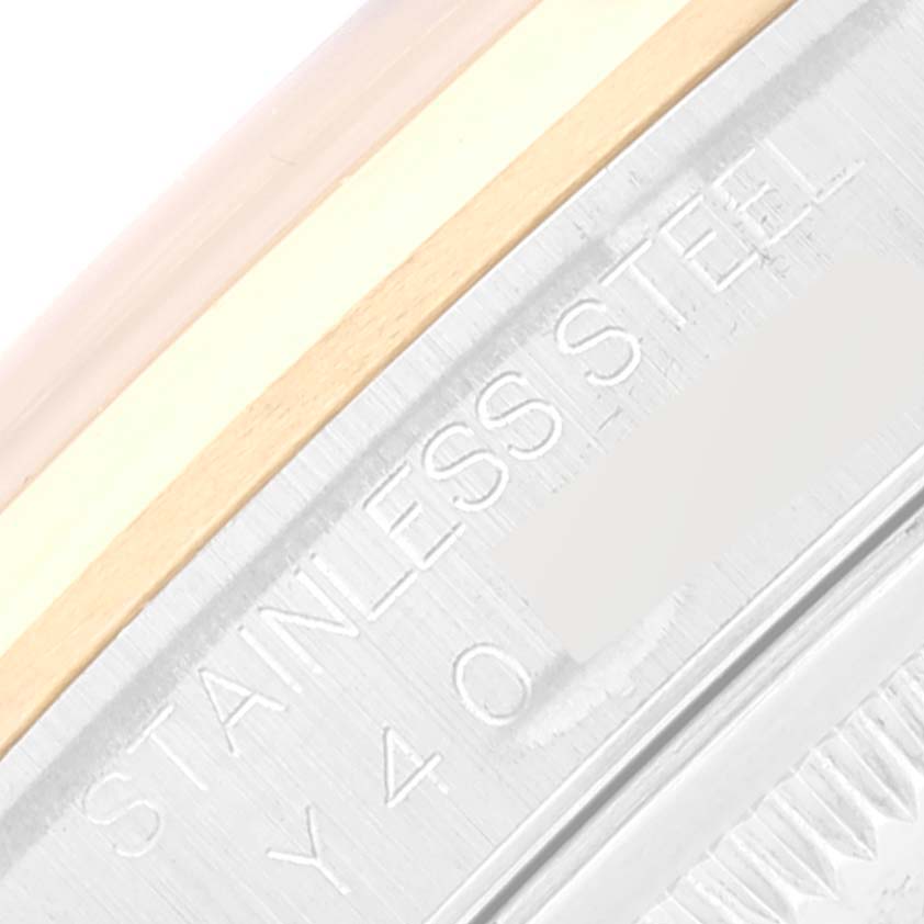 This close-up image shows the side engraving of a Rolex Datejust 16203 Men's Steel and Gold (two tone) Grey Dial 16203 Men's Steel and Gold (two tone) Grey Dial watch indicating "STAINLESS STEEL."