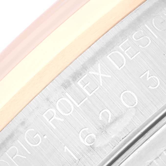 This is a close-up of the case back of a Rolex Datejust 16203 Men's Steel and Gold (two tone) Grey Dial 16203 Men's Steel and Gold (two tone) Grey Dial, showing part of the model number and design engraving.