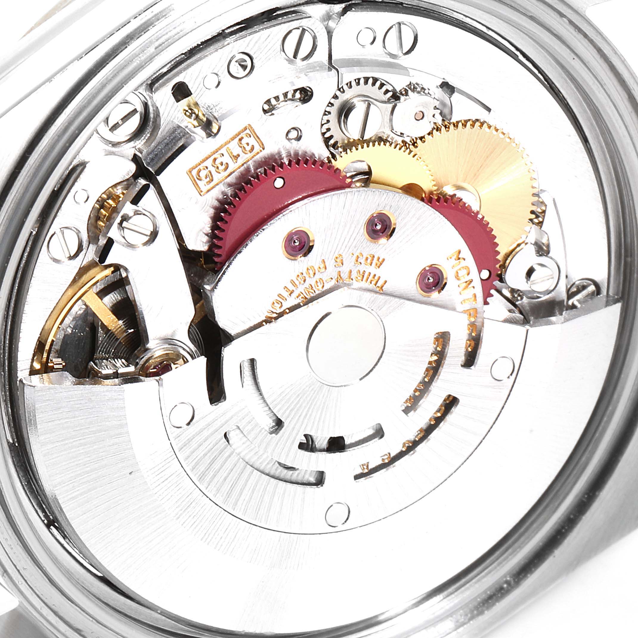 The image shows a close-up view of the movement mechanism of a Rolex Datejust 16233 Men
s Steel and Gold (two tone) Grey Dial 16233 Men
s Steel and Gold (two tone) Grey Dial watch.