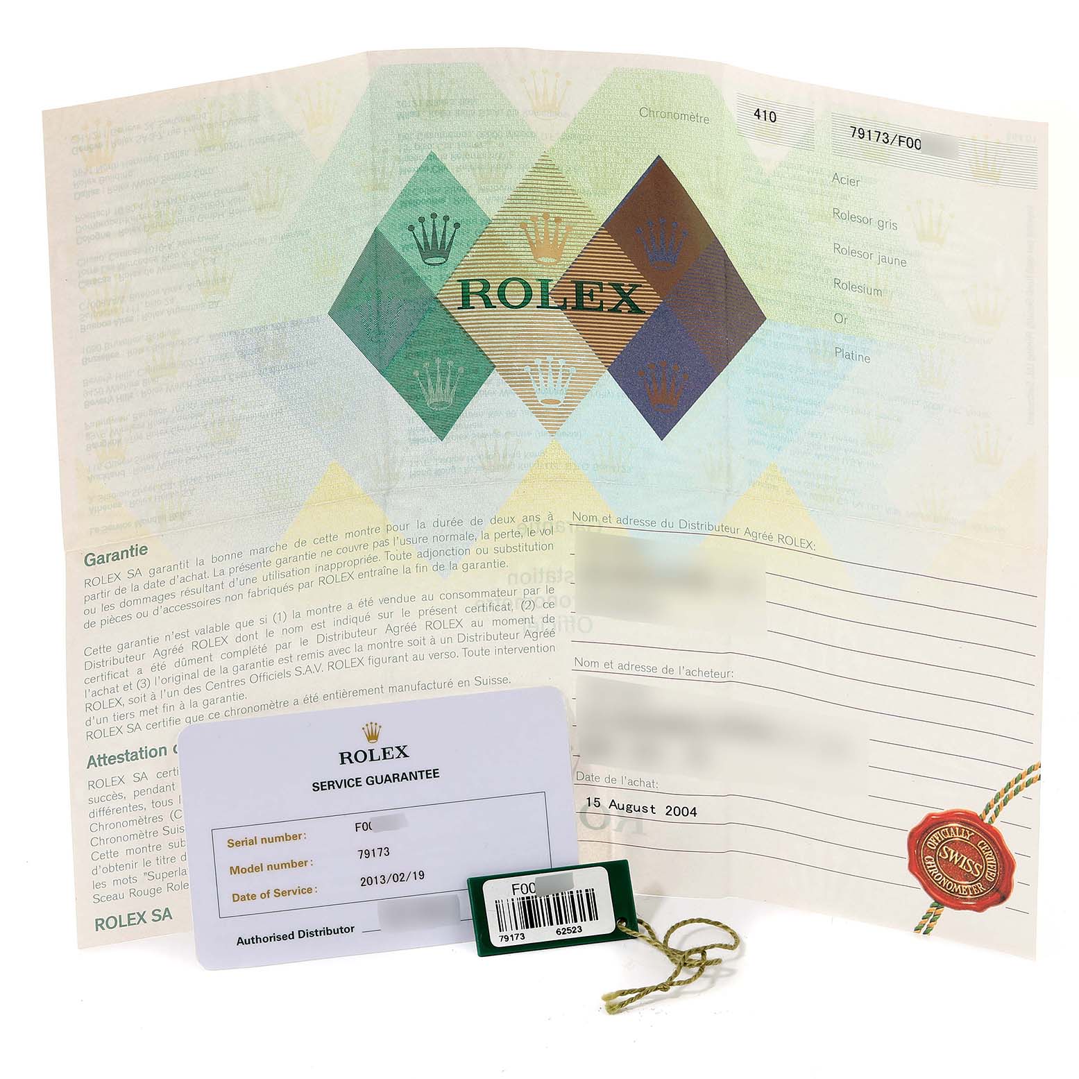 This image shows the warranty papers, service guarantee card, and a tag for a Rolex Datejust 79173 Women's Steel and Gold (two tone) White Dial 79173 Women's Steel and Gold (two tone) White Dial model.