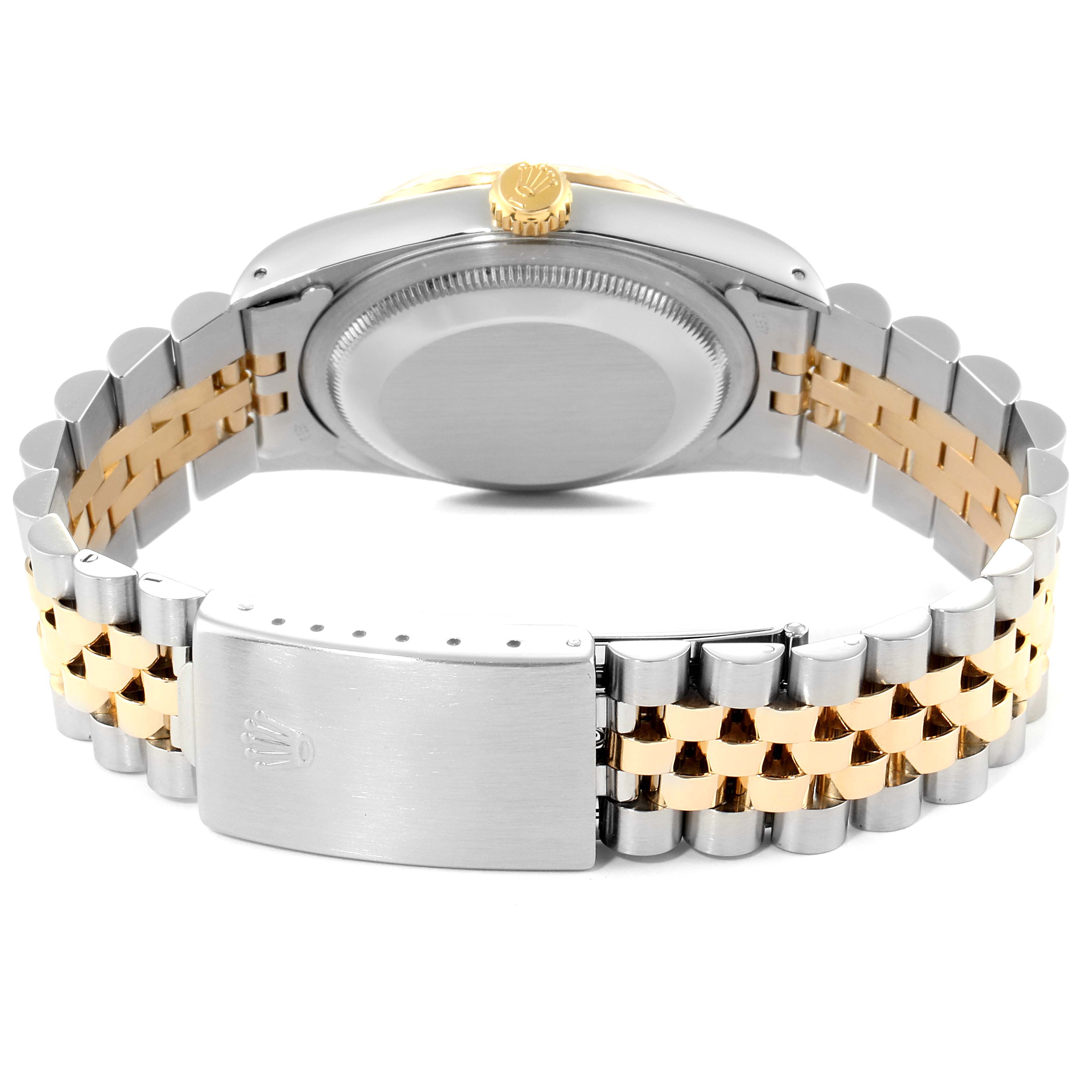 The image shows the back view of a Rolex Datejust 16233 Men
s Steel and Gold (two tone) White Dial 16233 Men
s Steel and Gold (two tone) White Dial watch, displaying its case back, crown, and two-tone bracelet with clasp.