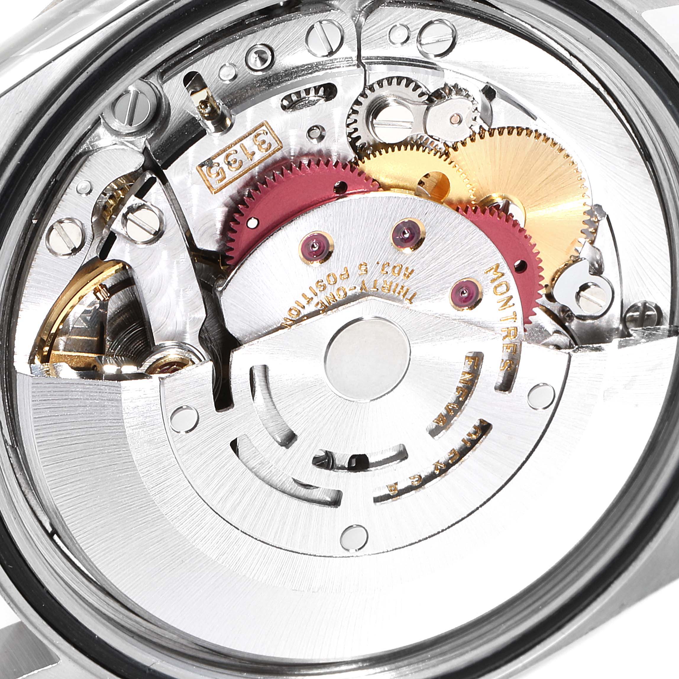 This image shows the intricate movement of a Rolex Datejust 16233 Men
s Steel and Gold (two tone) White Dial 16233 Men
s Steel and Gold (two tone) White Dial watch, focusing on its internal mechanical components.