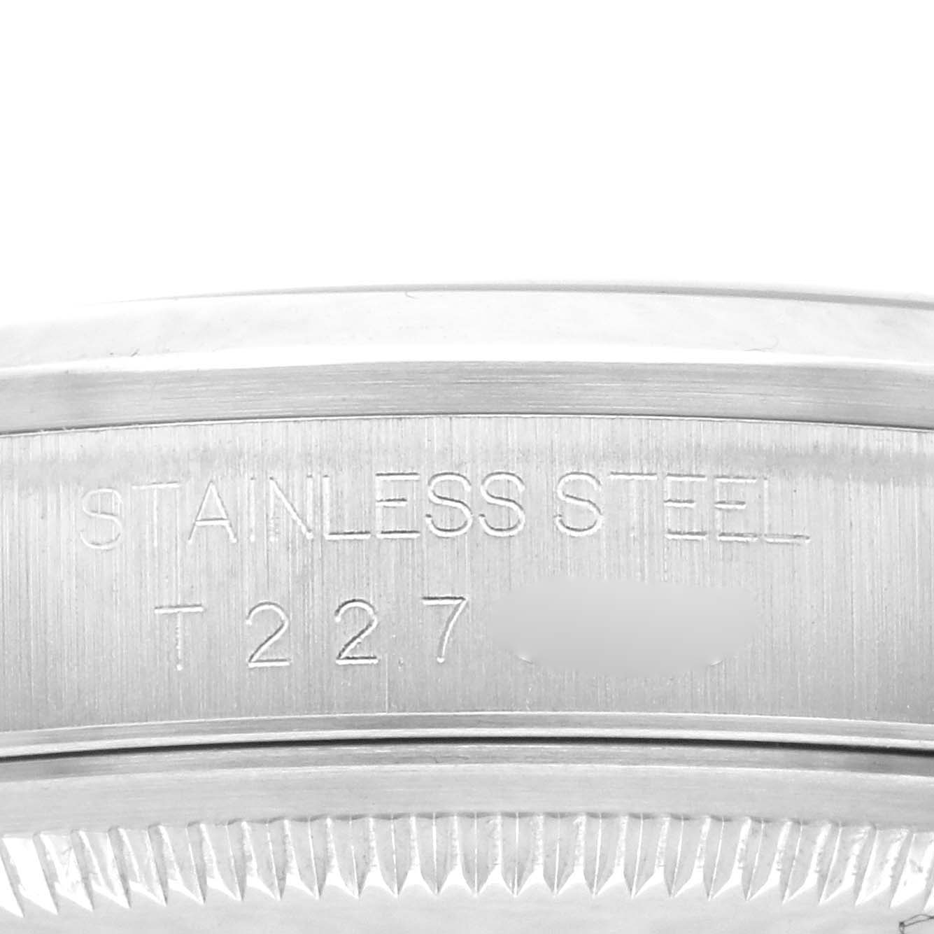 The image shows a close-up of the stainless steel engraving on the side casing of a Rolex Datejust 16200 Men's Stainless Steel White Dial 16200 Men's Stainless Steel White Dial watch.