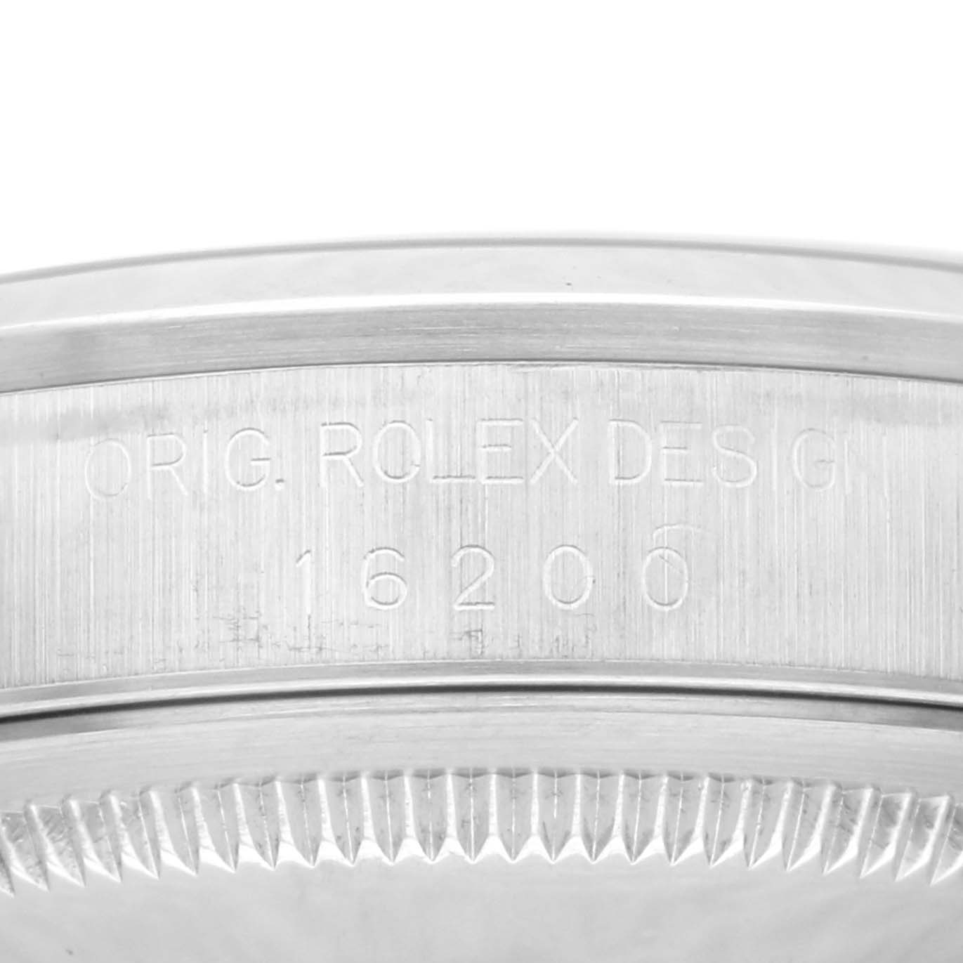 The image shows a close-up view of the engraved case back of a Rolex Datejust 16200 Men's Stainless Steel White Dial 16200 Men's Stainless Steel White Dial model.