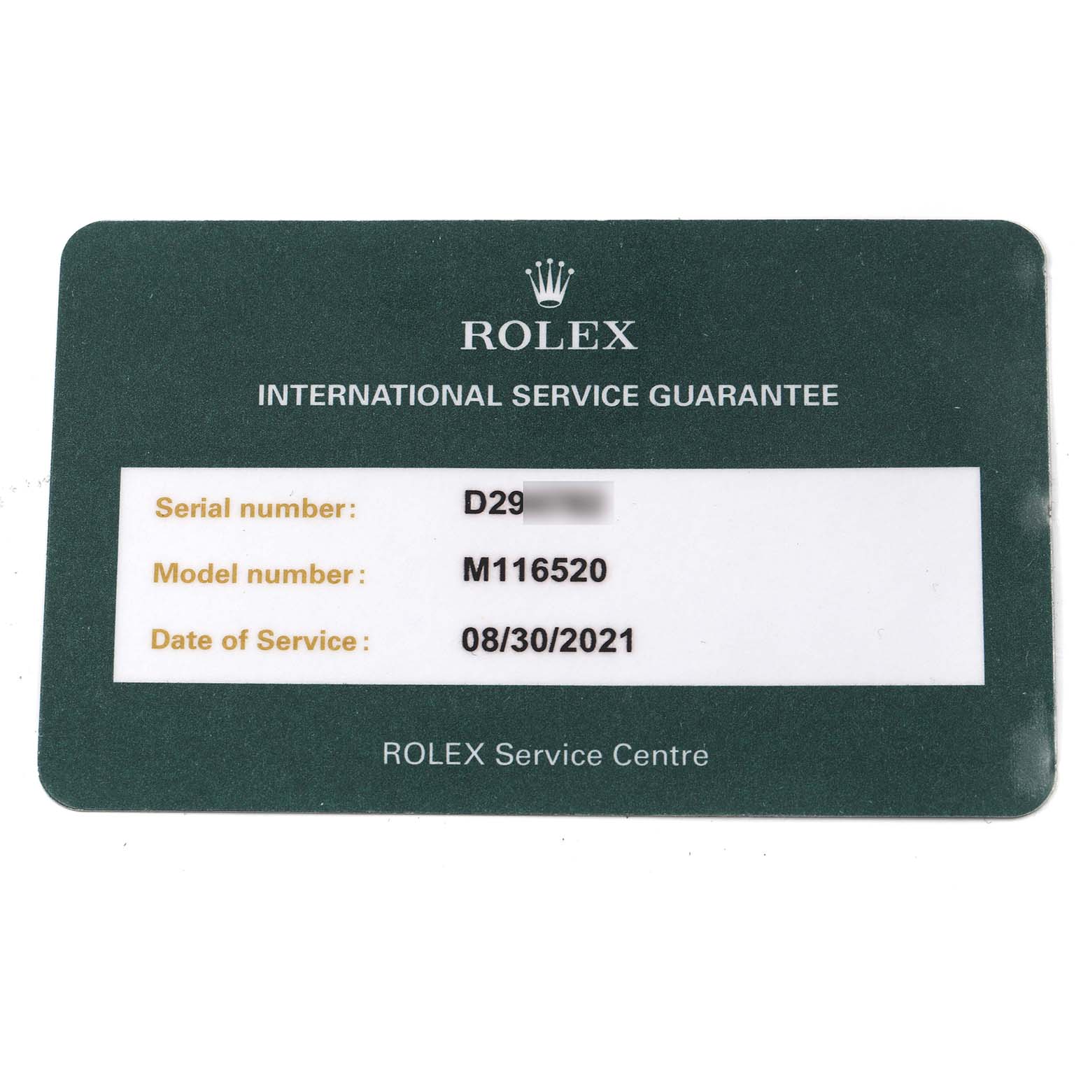 The image shows a Rolex International Service Guarantee card for model number M116520 of the Daytona watch.