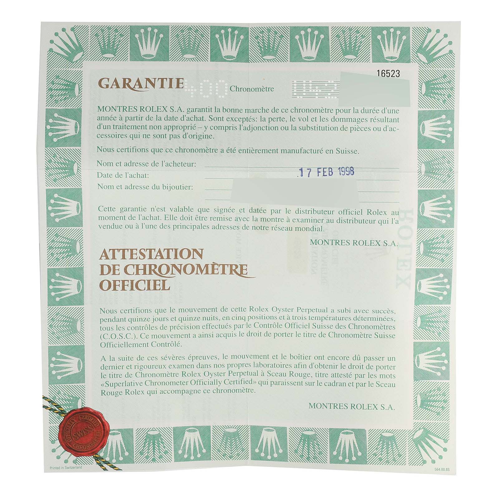 The image shows a close-up of a warranty certificate for the Rolex Daytona 16523 Men
s Steel and Gold (two tone) White Dial 16523 Men
s Steel and Gold (two tone) White Dial model, highlighting text and logos.