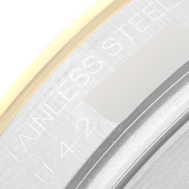 This close-up image shows a partial view of the edge, including the bezel and inner case, of a Rolex Daytona 16523 Men
s Steel and Gold (two tone) White Dial 16523 Men
s Steel and Gold (two tone) White Dial watch.