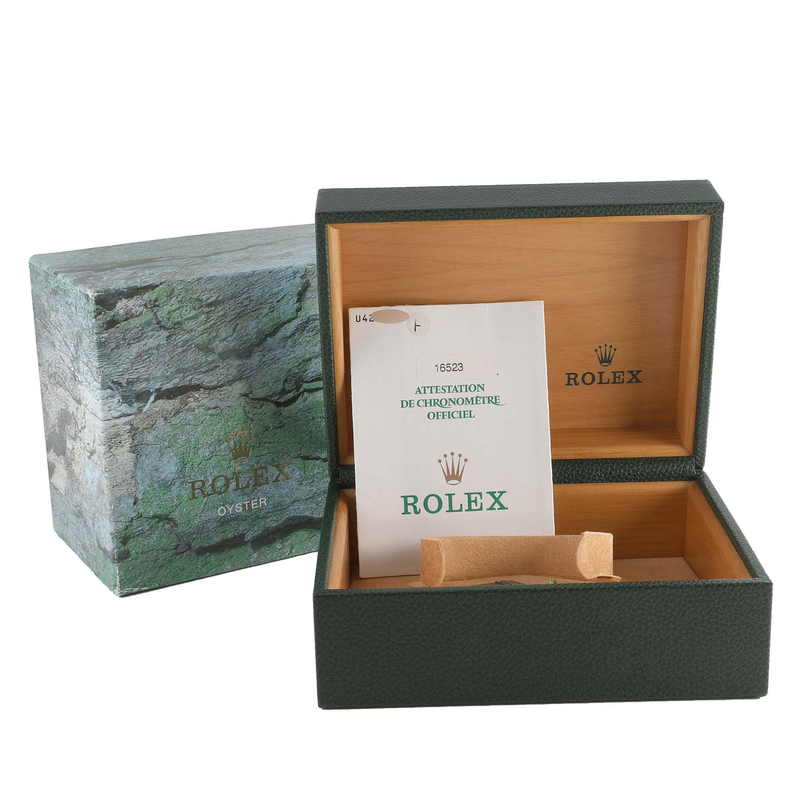 This image shows the opened box and papers for a Rolex Daytona 16523 Men
s Steel and Gold (two tone) White Dial 16523 Men
s Steel and Gold (two tone) White Dial model watch.