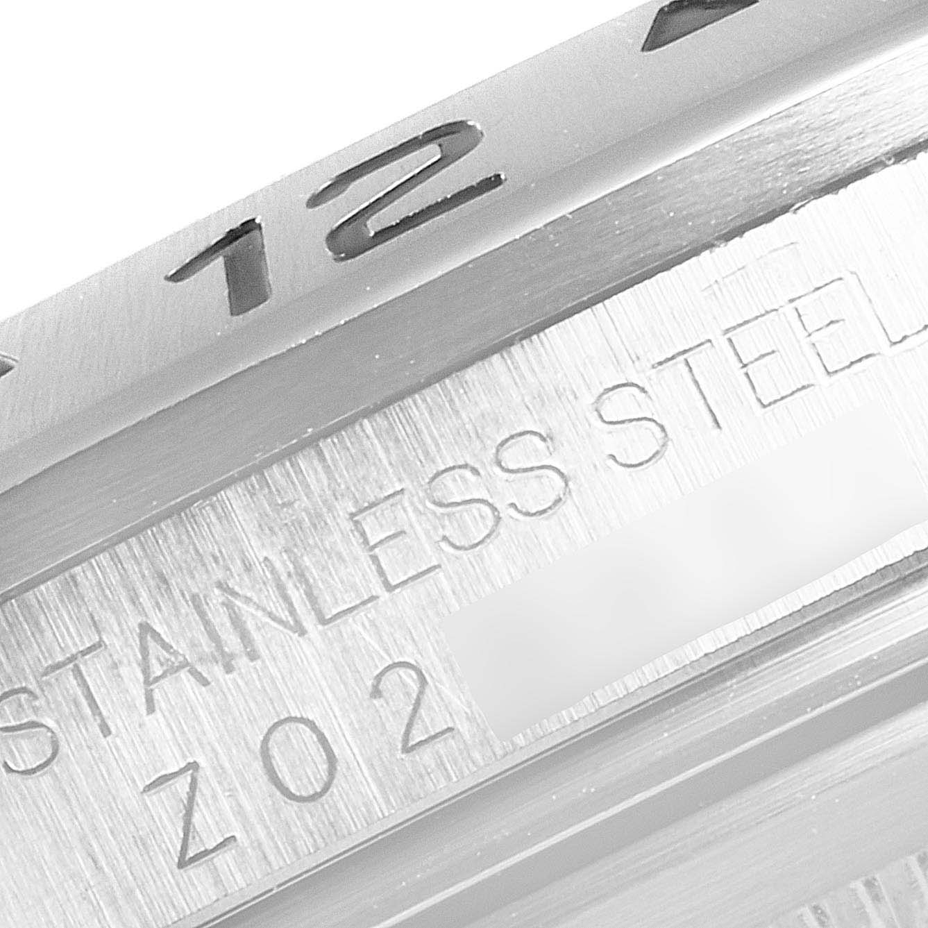 The image shows a close-up of the bezel and a portion of the case engraving of a Rolex Explorer 16570 Men
s Stainless Steel Black Dial 16570 Men
s Stainless Steel Black Dial watch.