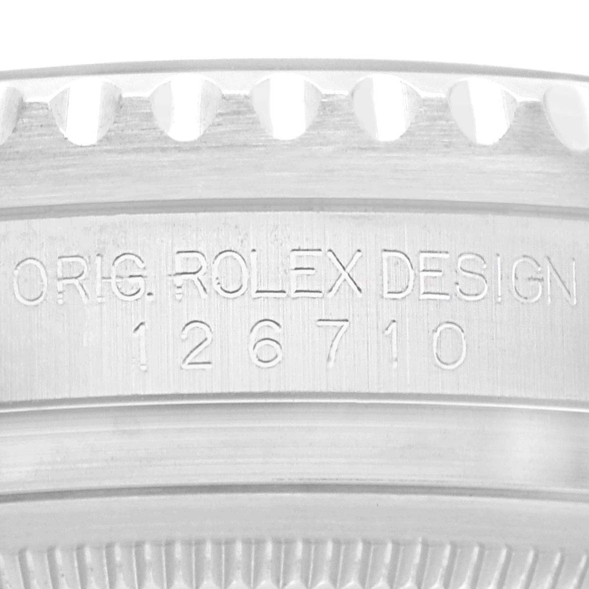 The image shows a close-up of the case side with engraved text for the Rolex GMT-Master 126710 Men
s Stainless Steel Black Dial model.