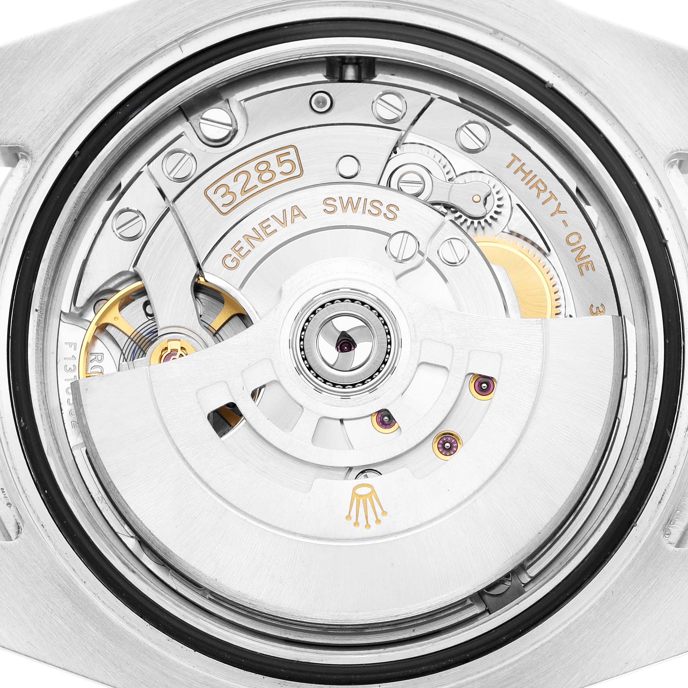 The image shows a close-up of the movement parts of a Rolex GMT-Master 126710 Men
s Stainless Steel Black Dial watch, viewed from the back.