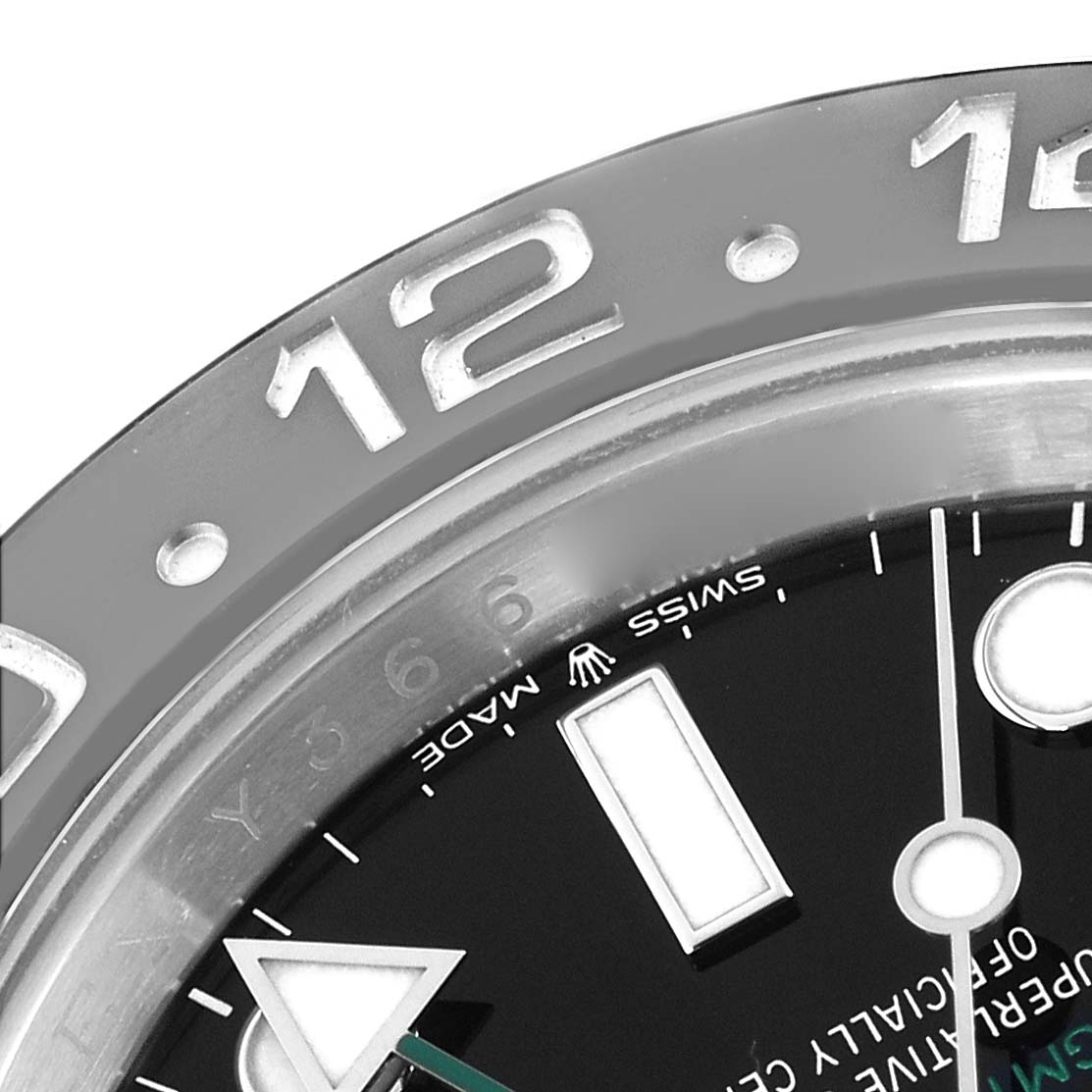 The image shows a close-up of the bezel and part of the dial of a Rolex GMT-Master 126710 Men
s Stainless Steel Black Dial watch.