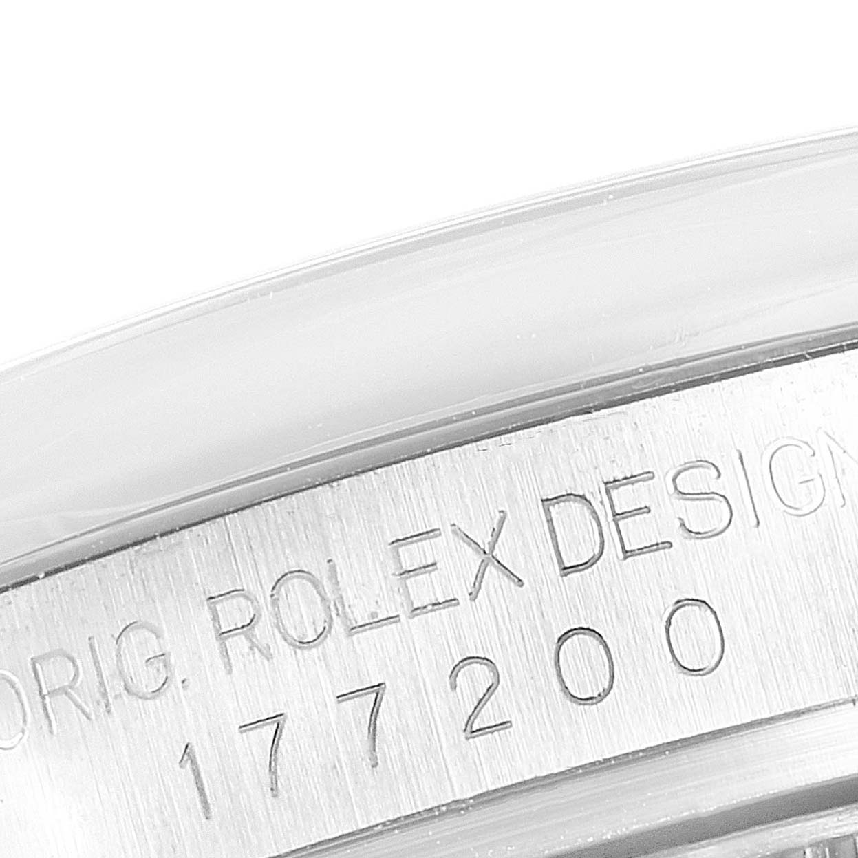 This image shows the engraved side of a Rolex Mid-Size 177200 Women
s Stainless Steel Black Dial 177200 Women
s Stainless Steel Black Dial watch case with the design and model number visible.