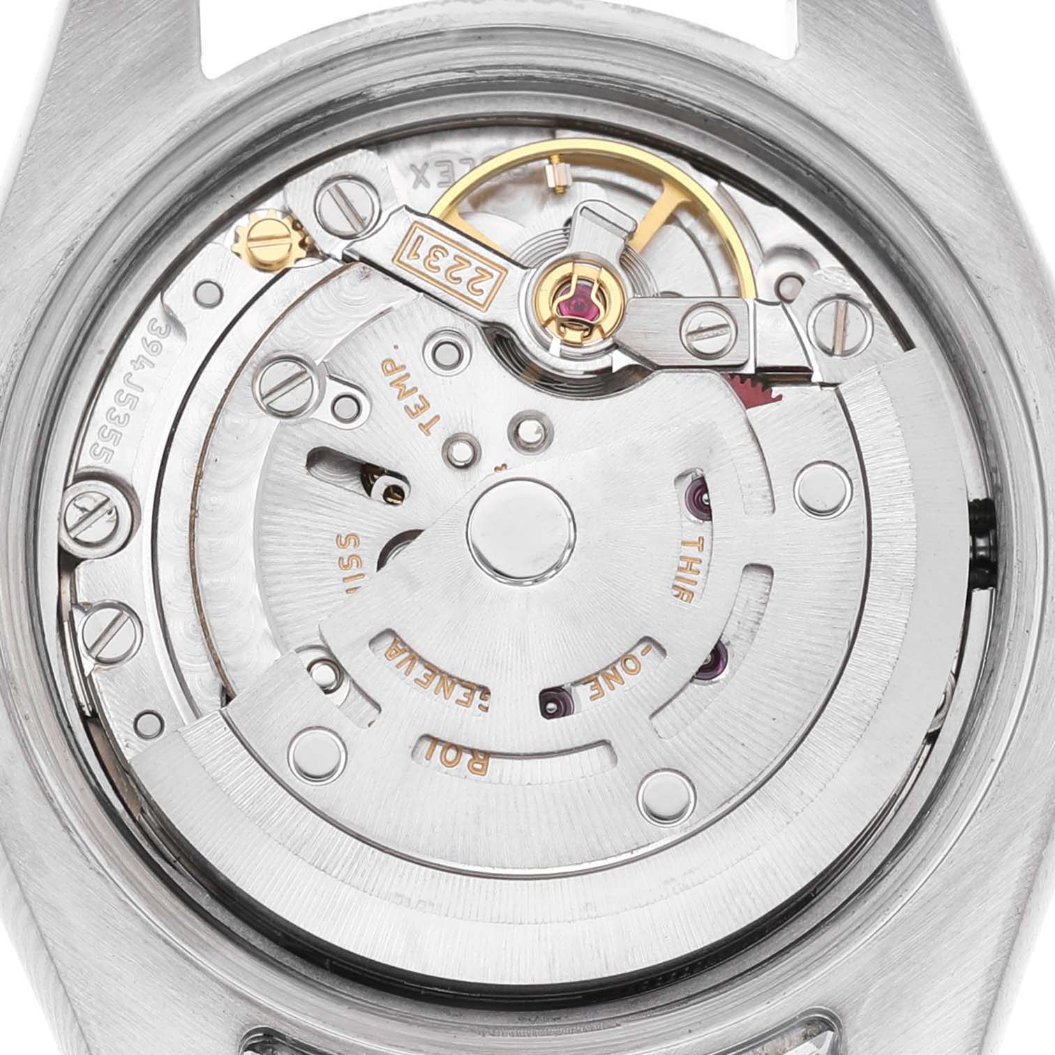 The image shows the movement and intricate internal parts of a Rolex Oyster Perpetual 176200 Women's Stainless Steel Silver Dial from the back.