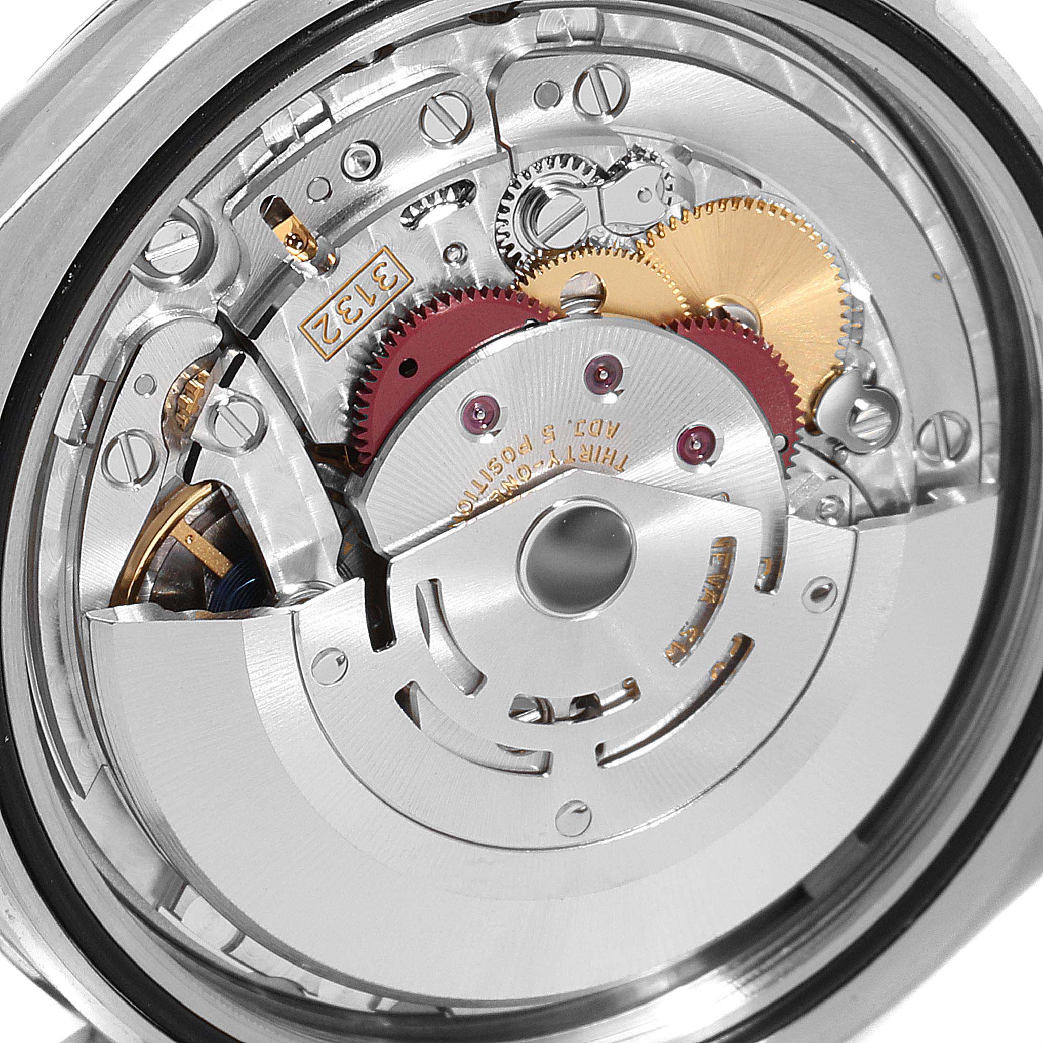 This image shows the intricate internal mechanism of a Rolex Oyster Perpetual 114300 Men's Stainless Steel Black Dial 114300 Men's Stainless Steel Black Dial watch, highlighting gears and other components.