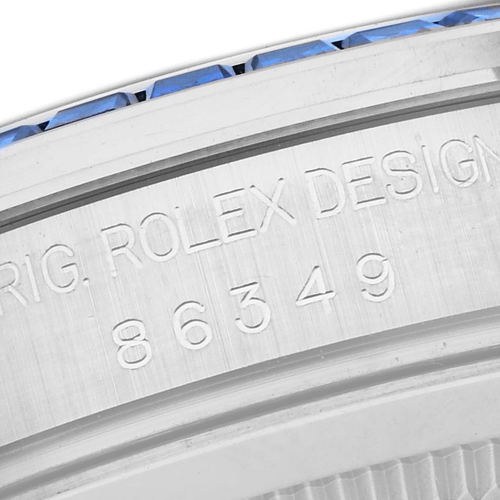 The image shows a close-up of the side of the Rolex Pearlmaster 86349SAFUBL Men
s White Gold Purple Dial 86349SAFUBL Men
s White Gold Purple Dial watch, highlighting its engraved serial number and design details.