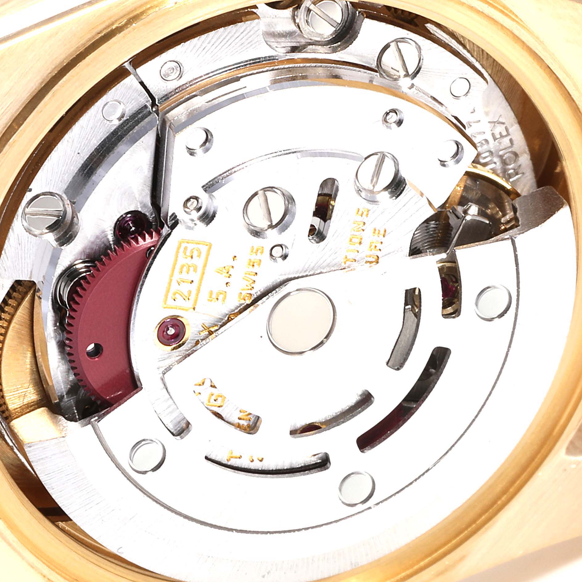 This image shows a close-up view of the movement mechanism inside a Rolex President 69138 Women
s Yellow Gold Champagne Dial 69138 Women
s Yellow Gold Champagne Dial model watch.