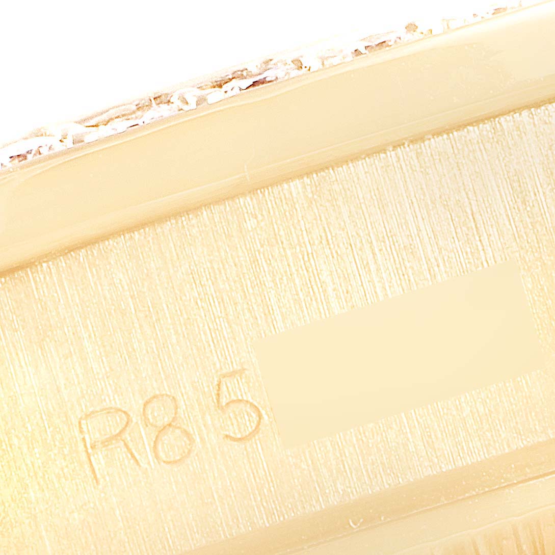 This is a close-up view of the serial number area on the case of a Rolex President 69138 Women
s Yellow Gold Champagne Dial 69138 Women
s Yellow Gold Champagne Dial model watch.