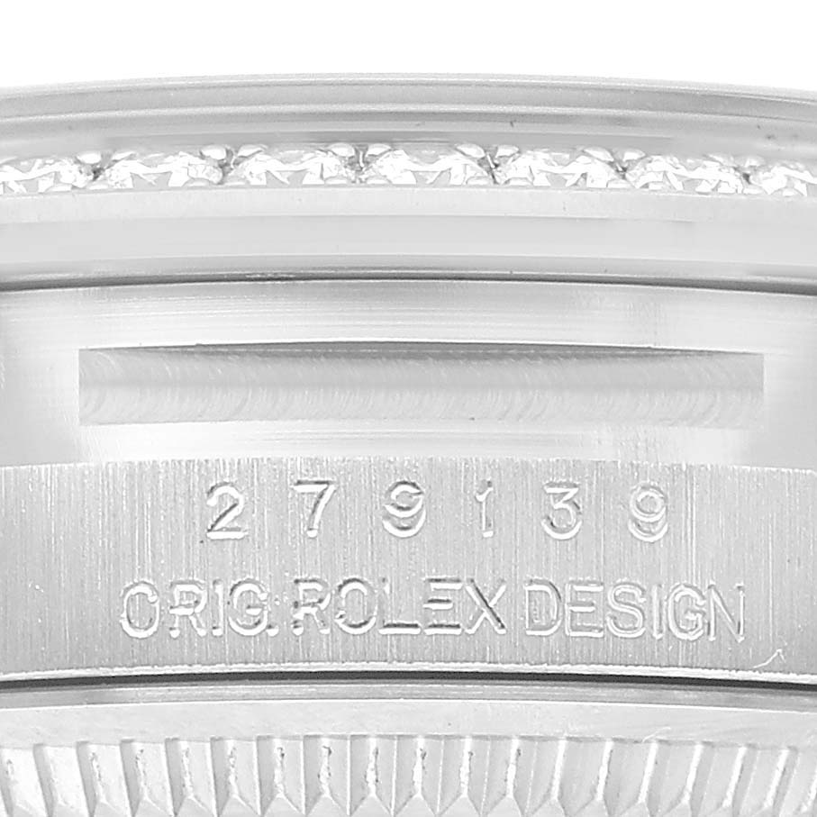 The image shows a close-up of the band and engraved serial number of a Rolex President 279139 Women's White Gold Silver Dial watch.