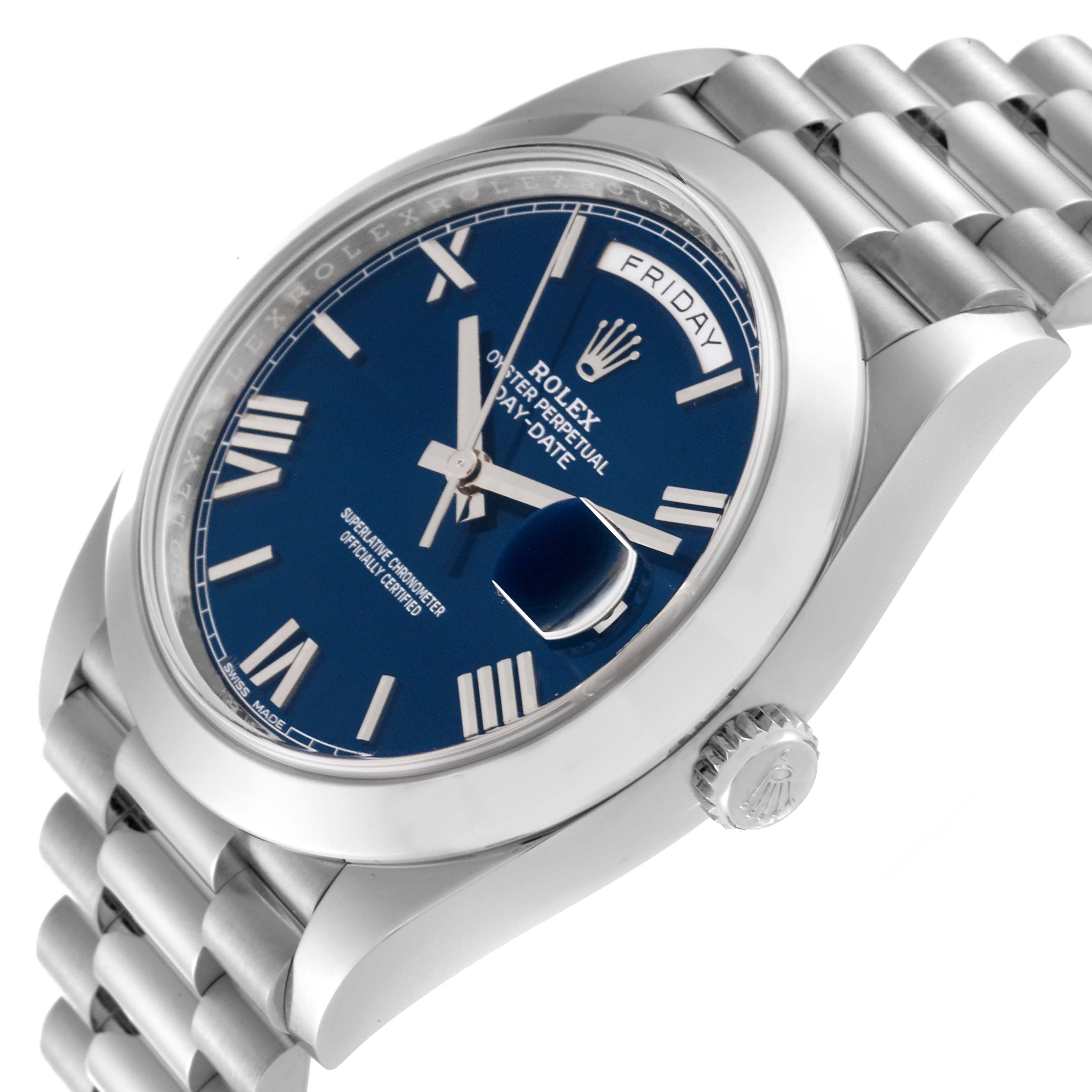 This image shows a close-up side angle of a Rolex President 228206 Men
s Platinum Blue Dial 228206 Men
s Platinum Blue Dial model watch displaying the face, crown, and bracelet.