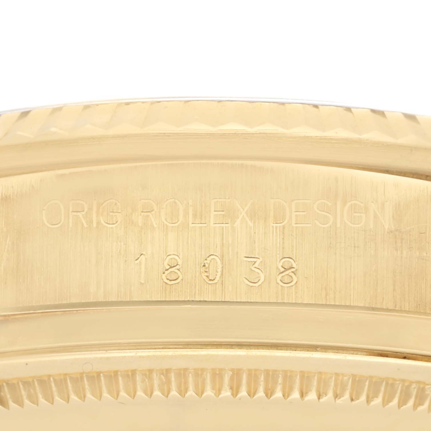 This close-up image shows the side of the Rolex President 18038 Men's Yellow Gold Black Dial 18038 Men's Yellow Gold Black Dial model watch, featuring the engraved design number "18038."