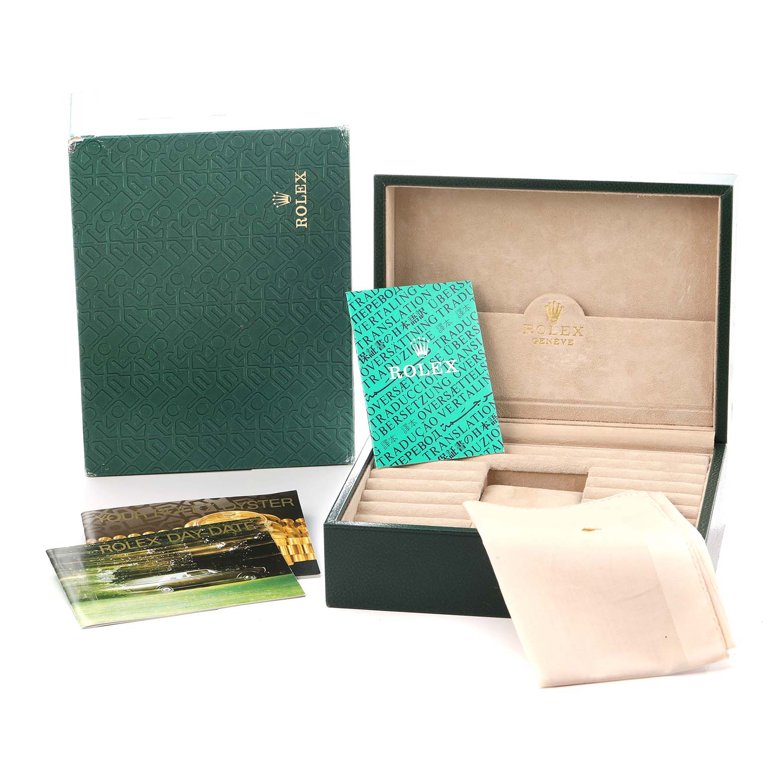The image shows the Rolex President 18238 Men
s Yellow Gold Champagne Dial model accessories, including the box, booklets, and a cloth at a slight angle.