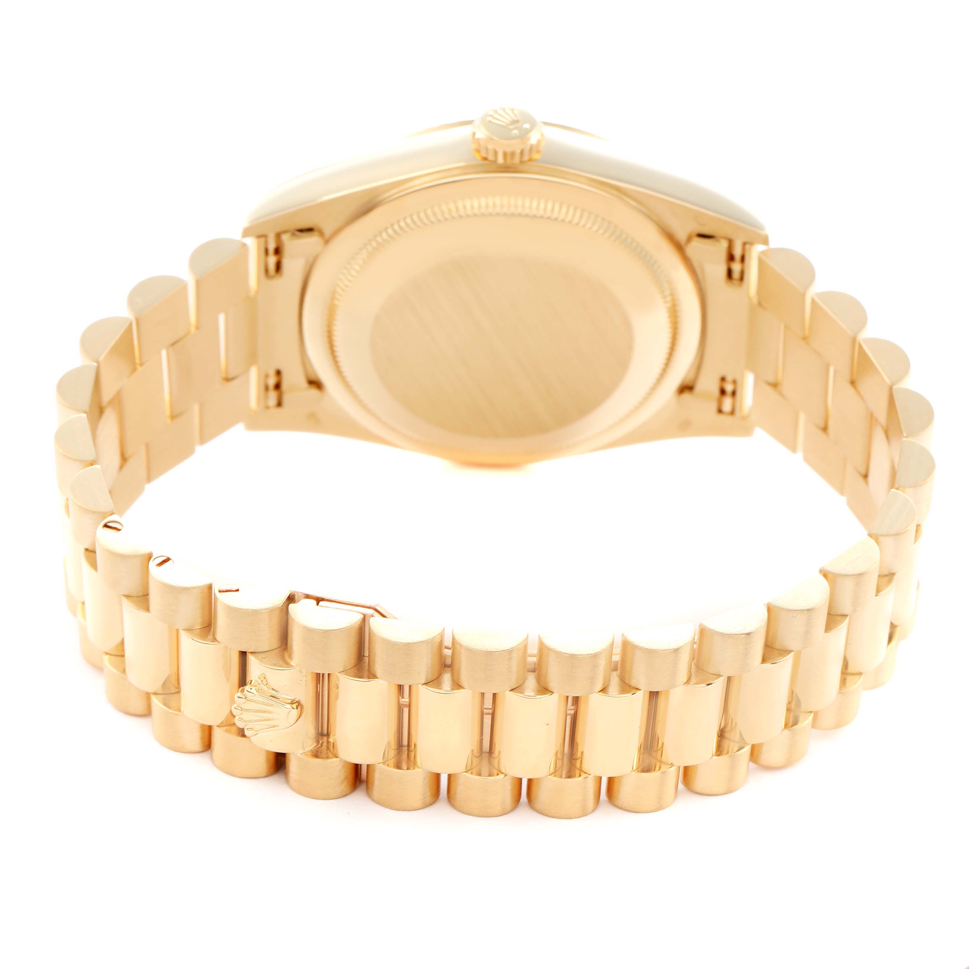 The Rolex President 18238 Men
s Yellow Gold Champagne Dial model is shown from the rear, displaying the case back and the full bracelet.