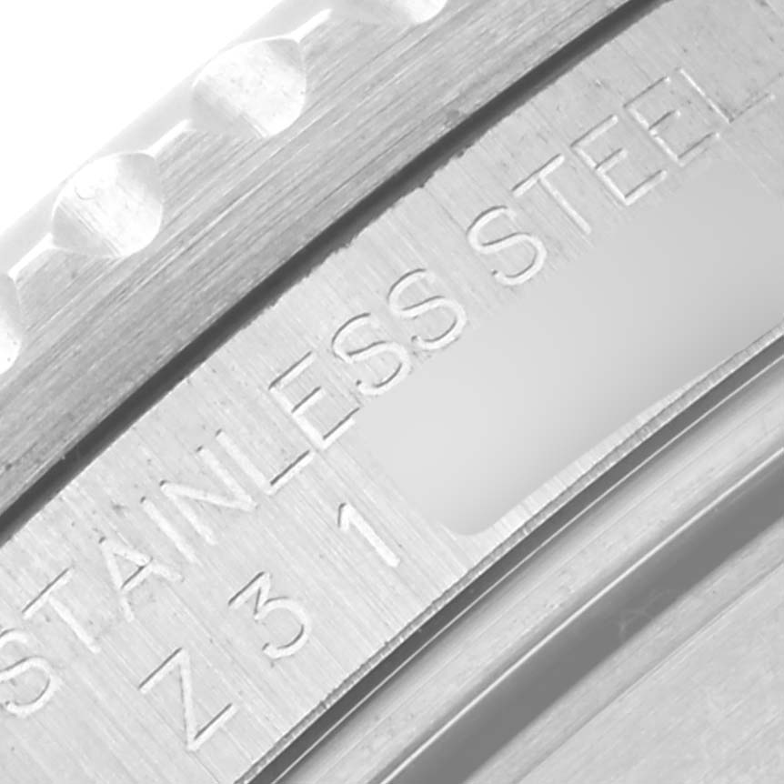 This is a close-up shot of the case back showing the serial and material engraving on a Rolex Submariner 16610 Men's Stainless Steel Black Dial 16610 Men's Stainless Steel Black Dial watch.