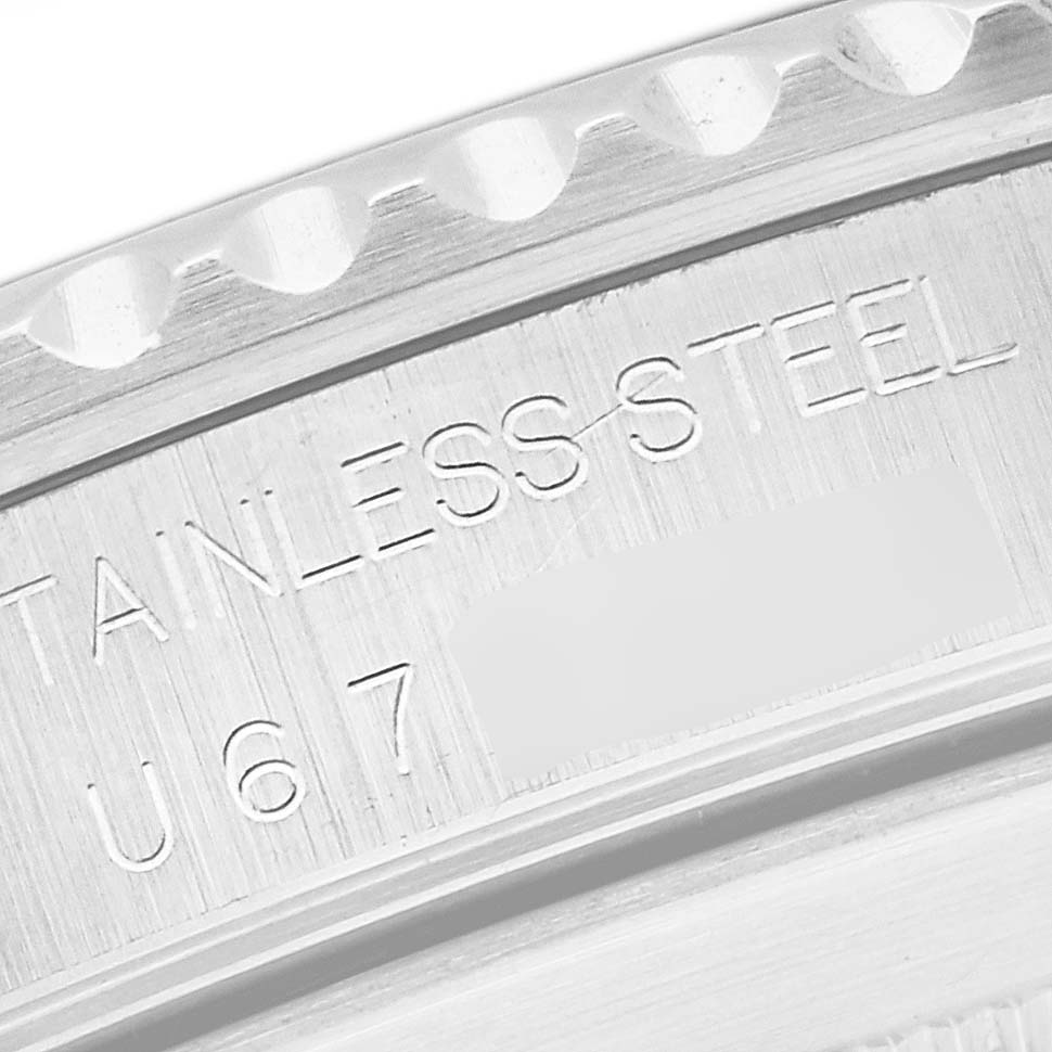 This image shows a close-up of the engraved stainless steel case back on a Rolex Submariner 14060 Men's Stainless Steel Black Dial 14060 Men's Stainless Steel Black Dial watch.