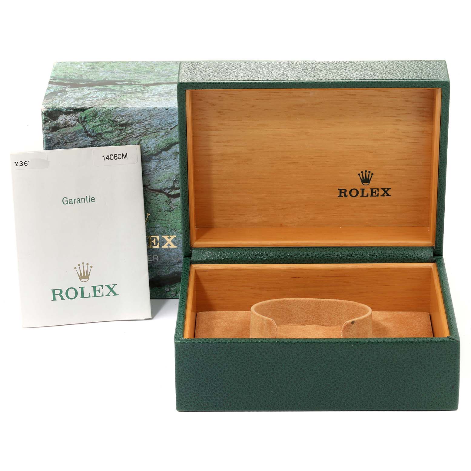The image shows an open green Rolex box for the Submariner model, with a warranty booklet beside it.