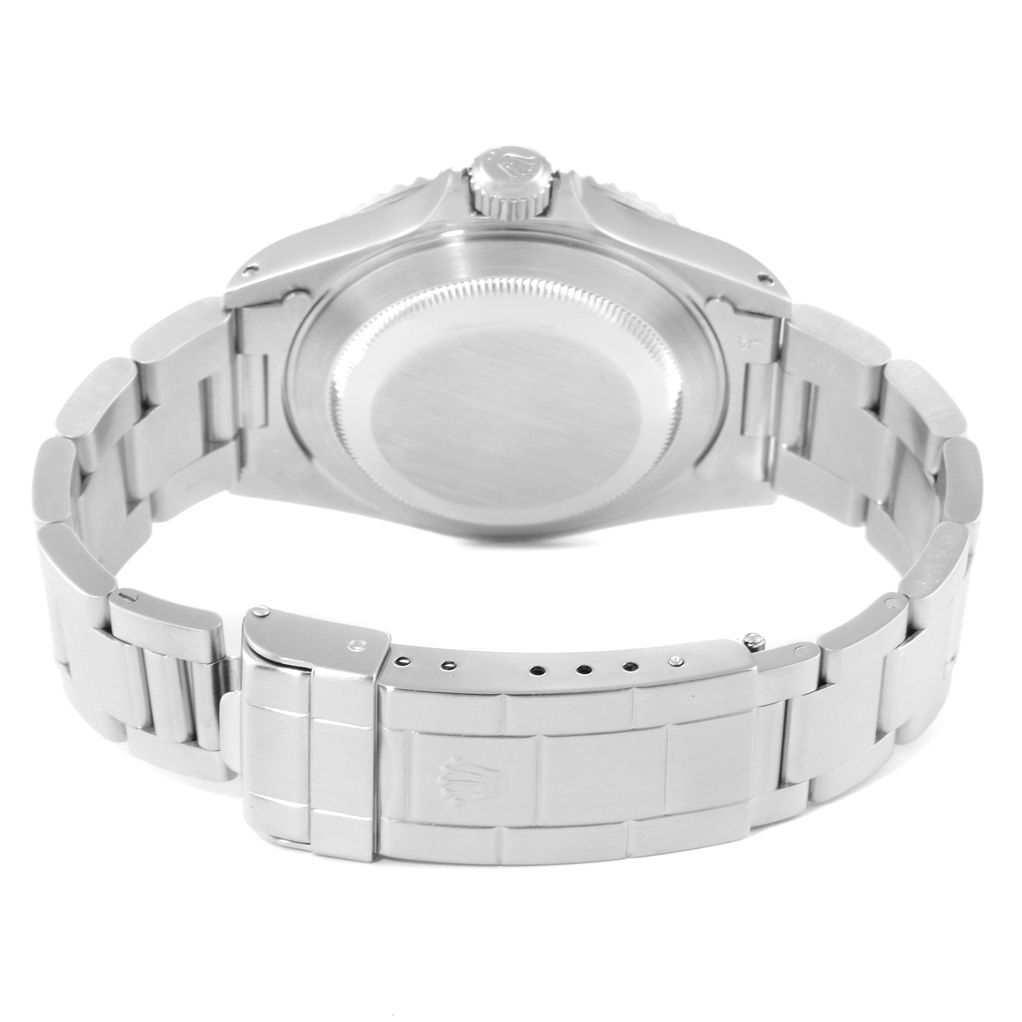 This is a Rolex Submariner 14060 Men
s Stainless Steel Black Dial 14060 Men
s Stainless Steel Black Dial model viewed from the back, showing the case back, crown, and stainless steel bracelet clasp.