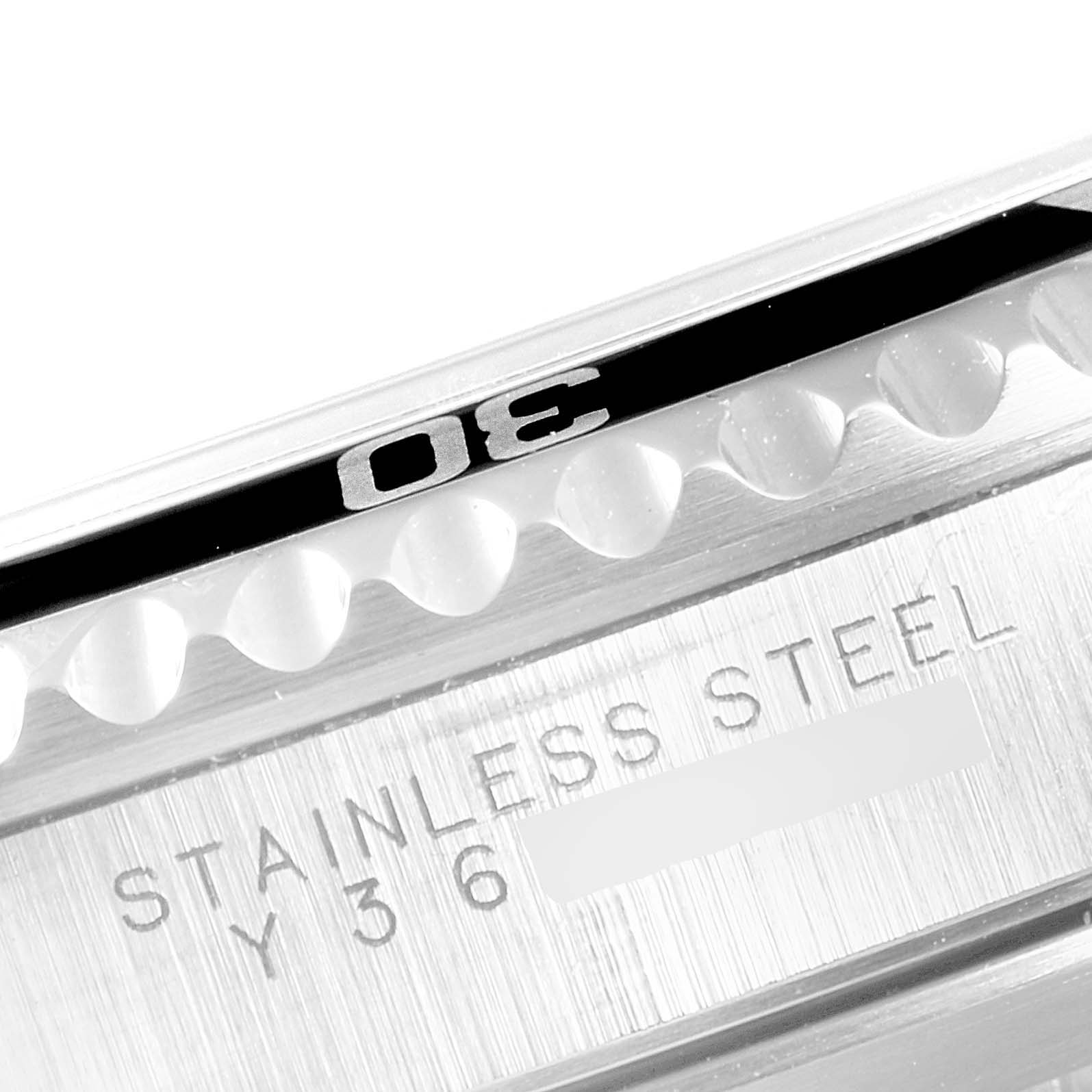 The image shows the bezel and a portion of the stainless steel case with engraving on a Rolex Submariner 14060 Men
s Stainless Steel Black Dial 14060 Men
s Stainless Steel Black Dial watch.