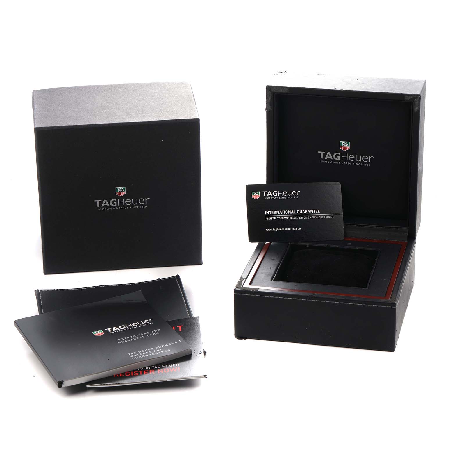 The image shows the Tag Heuer Carrera CV2A1R Men
s Stainless Steel Black Dial watch box, open with the inner cushion, warranty card, and manuals displayed.