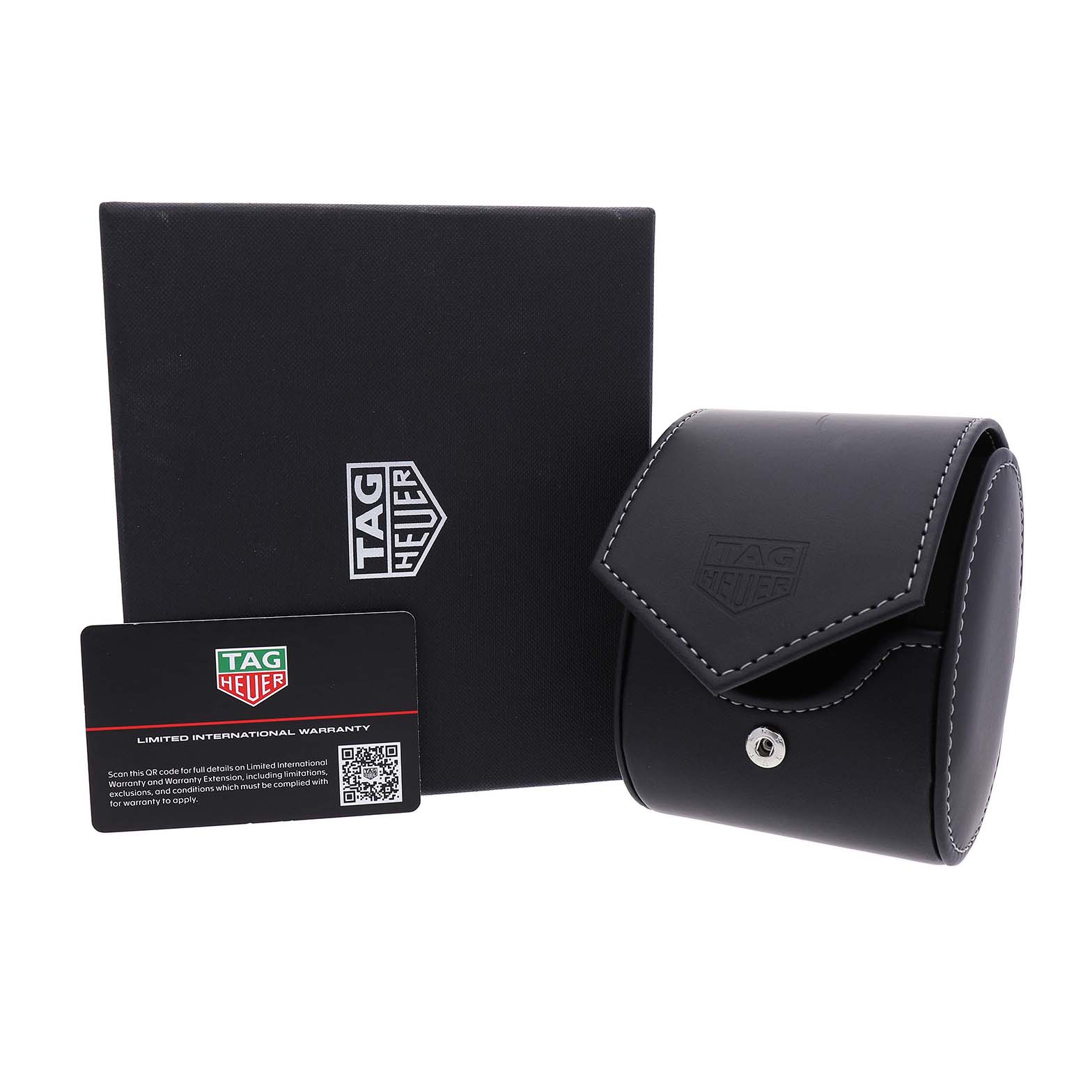 The image shows the packaging and warranty card for a Tag Heuer Monaco CDW2181 Men's Titanium Blue Dial watch, including a box and travel pouch.