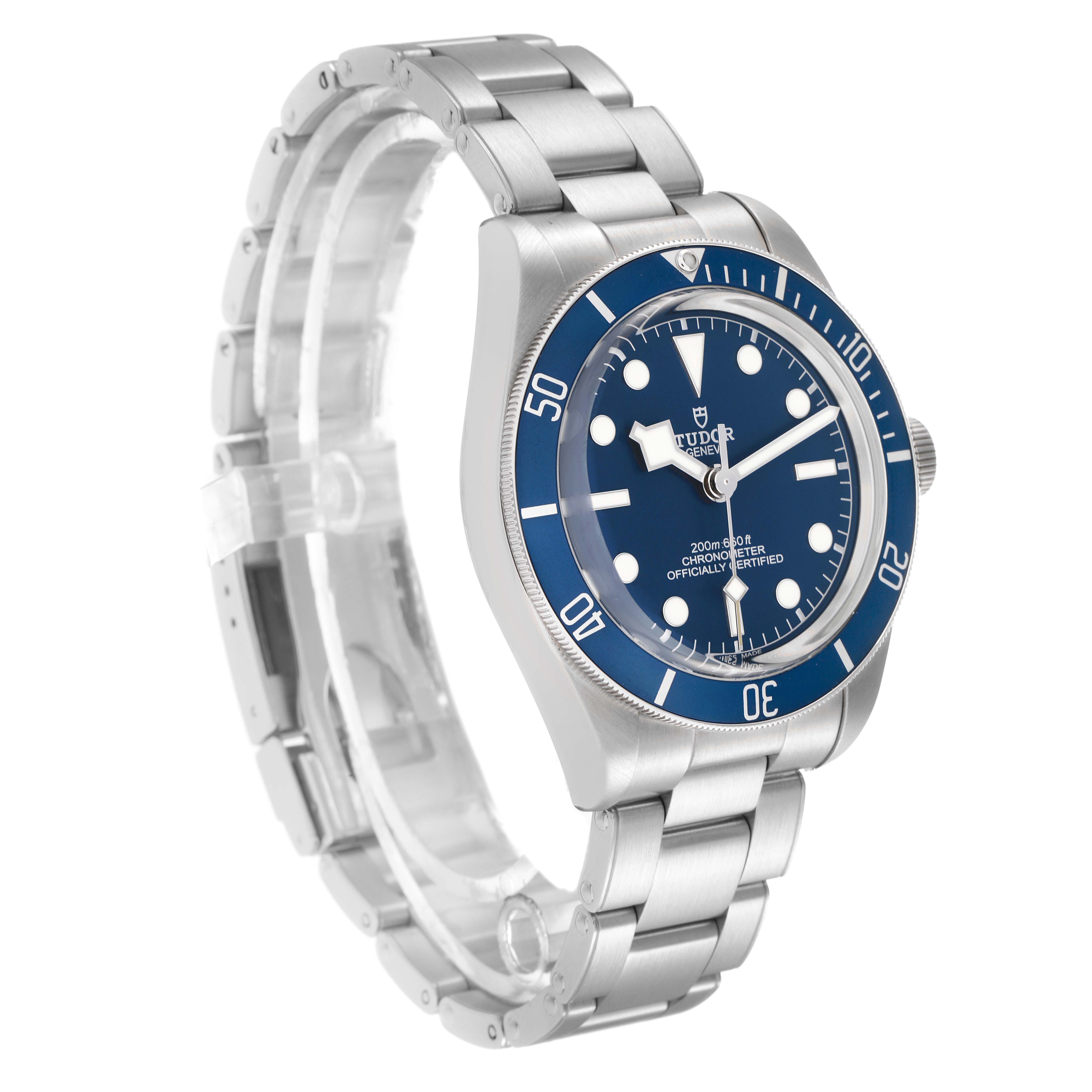 The Tudor Heritage Black Bay 79030B Men
s Stainless Steel Blue Dial watch is shown at a three-quarter angle, displaying the face, bezel, and stainless steel bracelet.