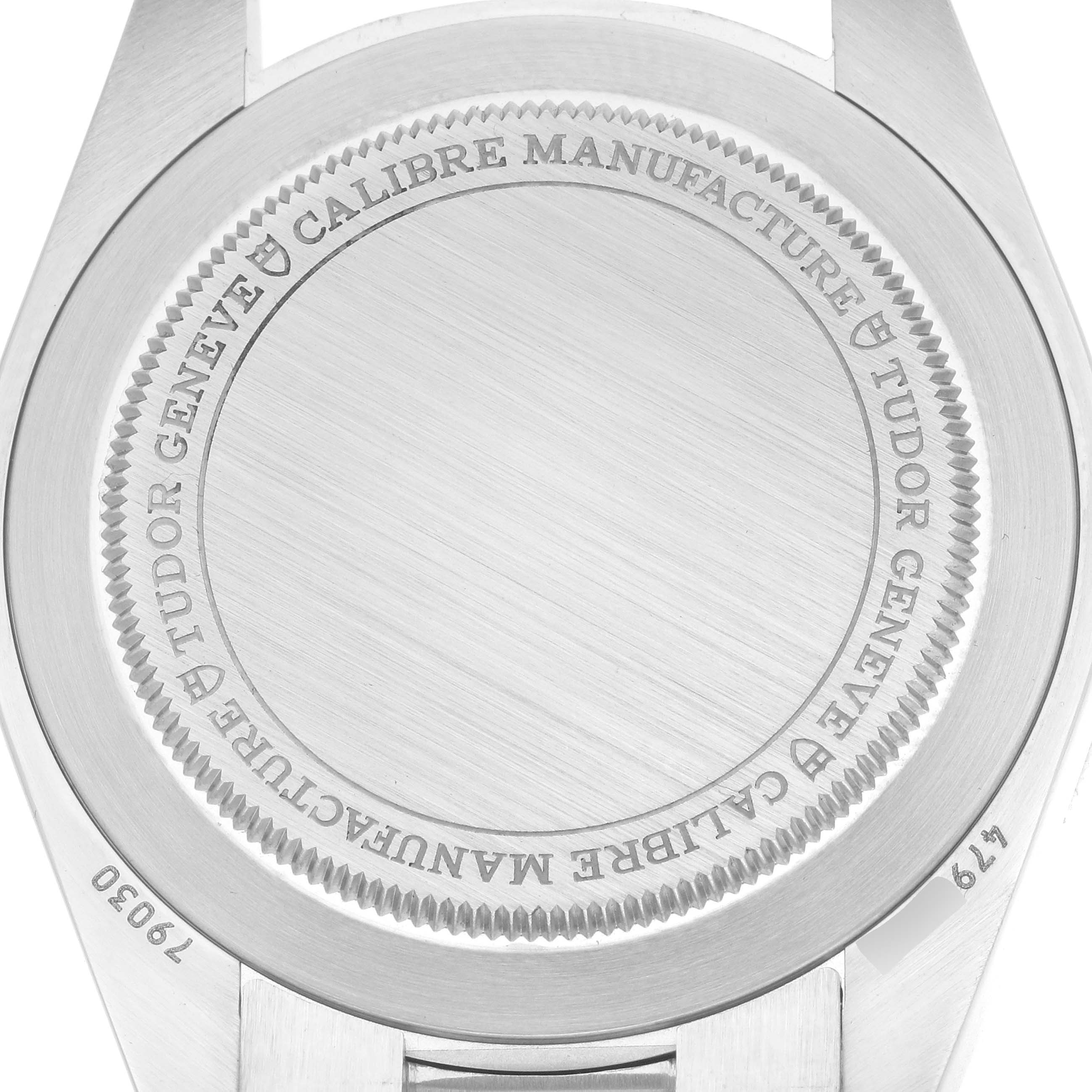 The image shows the case back of a Tudor Heritage Black Bay 79030B Men
s Stainless Steel Blue Dial watch, focusing on the engraving details.