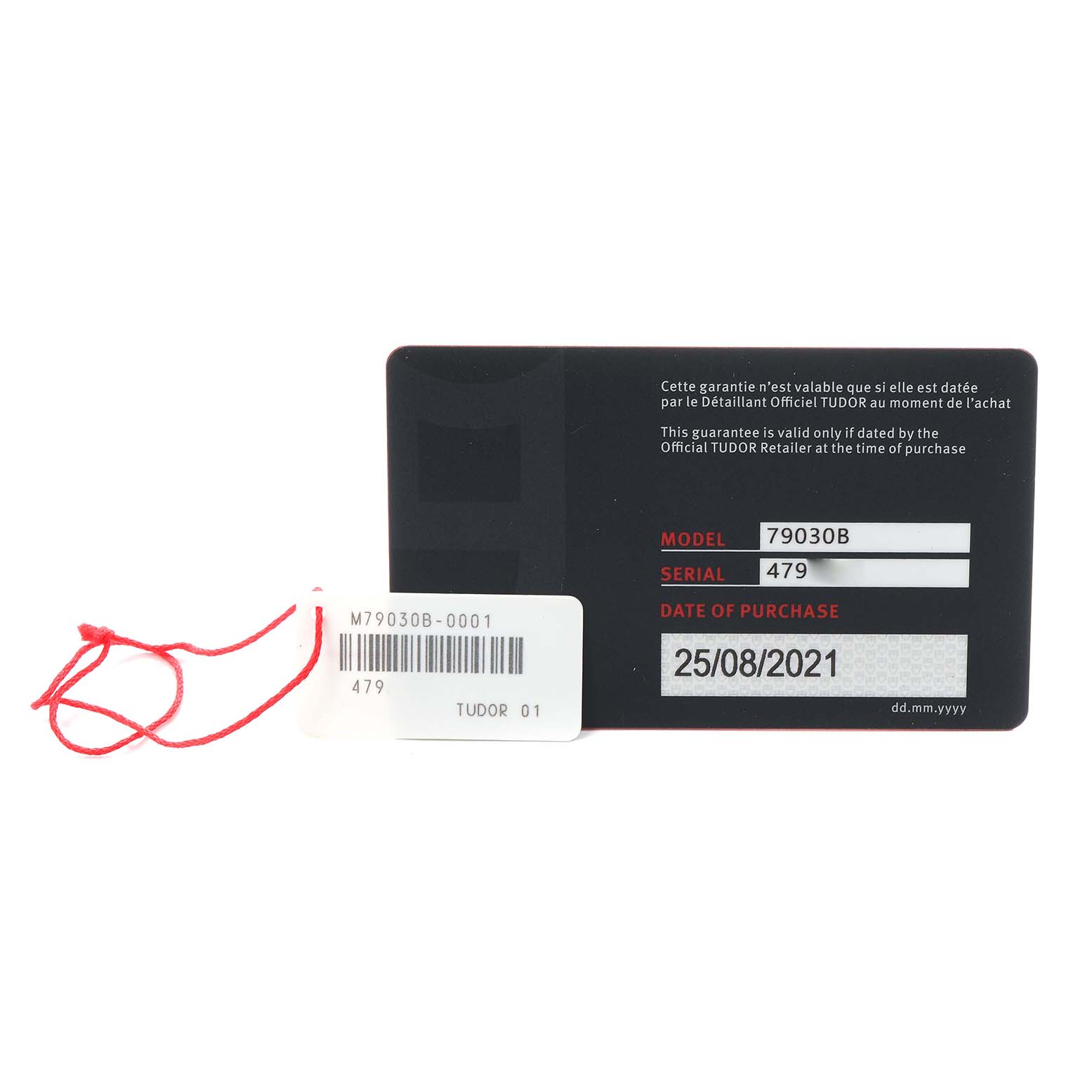 The image shows a warranty card and tag for the Tudor Heritage Black Bay 79030B Men
s Stainless Steel Blue Dial model, displaying model, serial number, and purchase date.