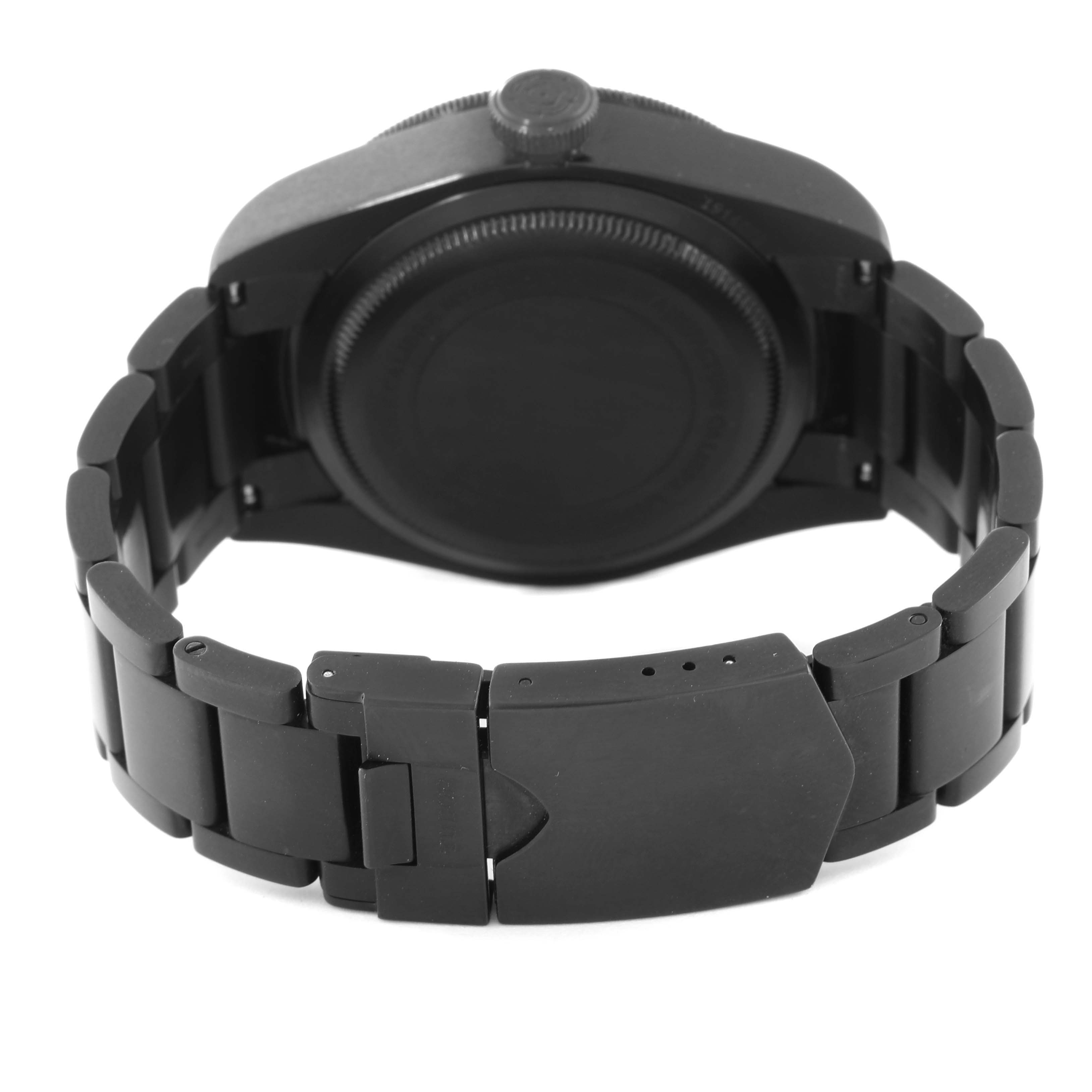 The image shows the backside of a Tudor Heritage Black Bay 79230DK Men's Stainless Steel Black Dial 79230DK Men's Stainless Steel Black Dial watch, highlighting its clasp and bracelet.