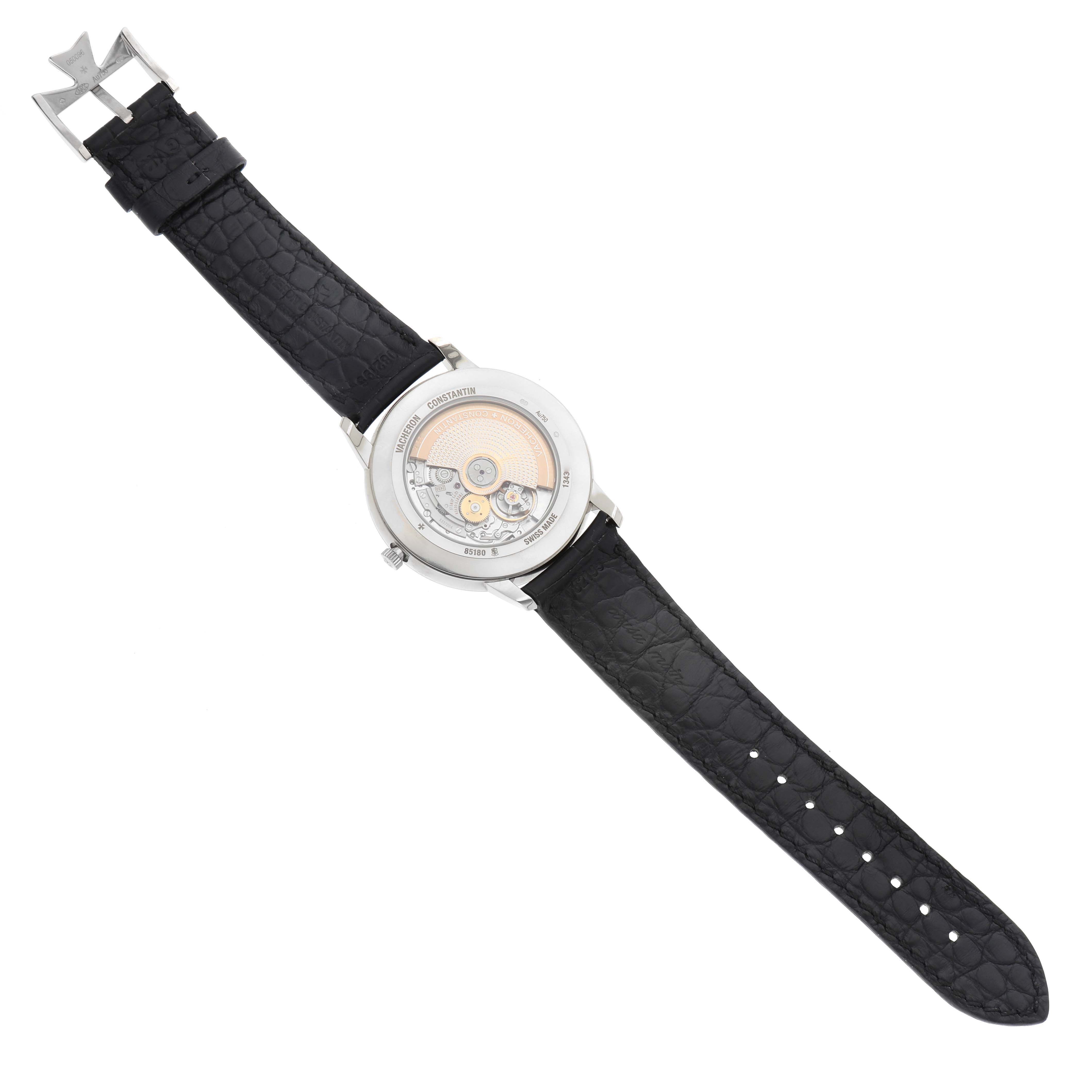 This image shows the case back and movement of the Vacheron Constantin Patrimony 85180/000G-9230 Men
s White Gold Silver Dial 85180/000G-9230 Men
s White Gold Silver Dial watch, with a black leather strap.