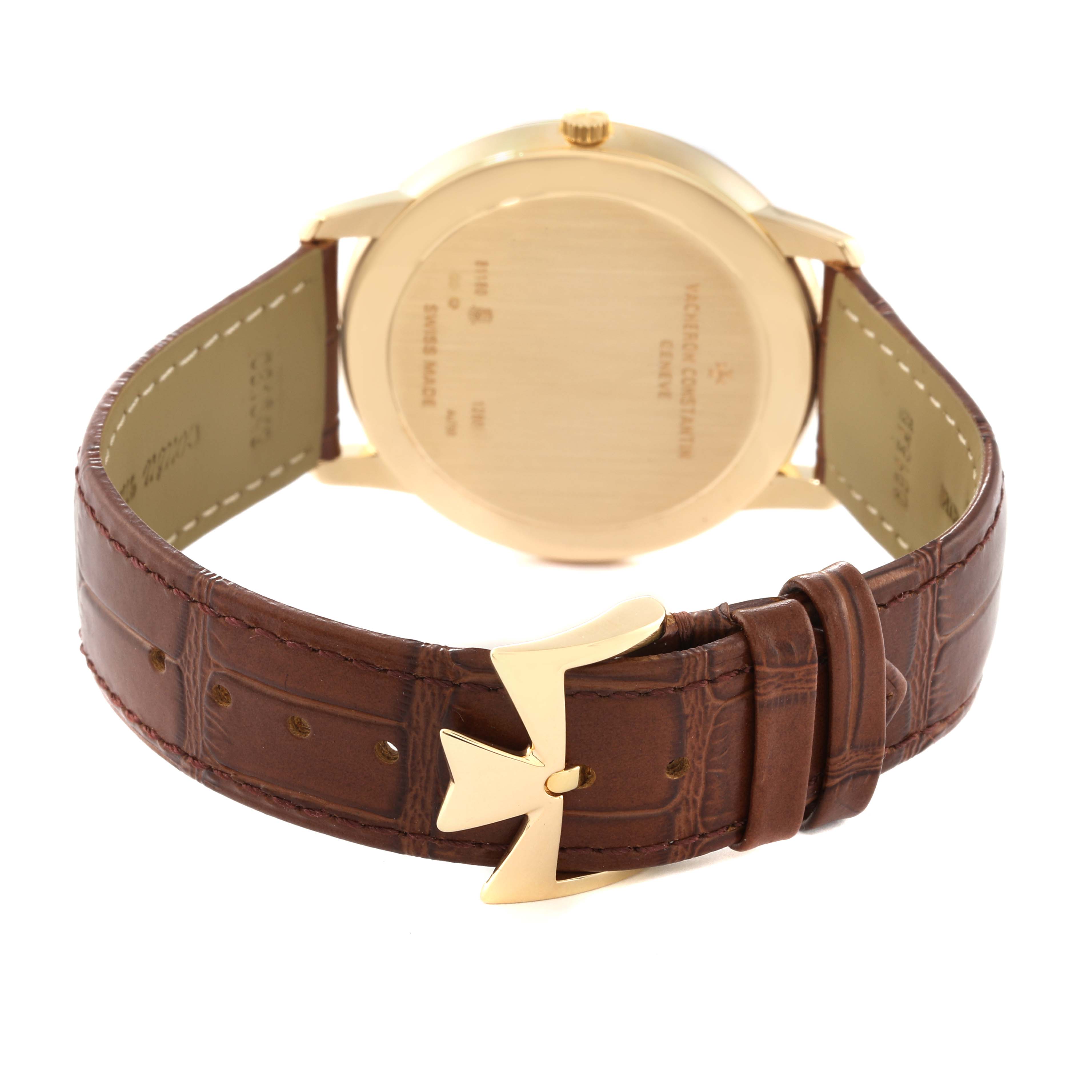 The image shows the back of the Vacheron Constantin Patrimony 81180/000J-9118 Men's Yellow Gold Silver Dial 81180/000J-9118 Men's Yellow Gold Silver Dial watch and its brown leather strap with a distinctive gold buckle.