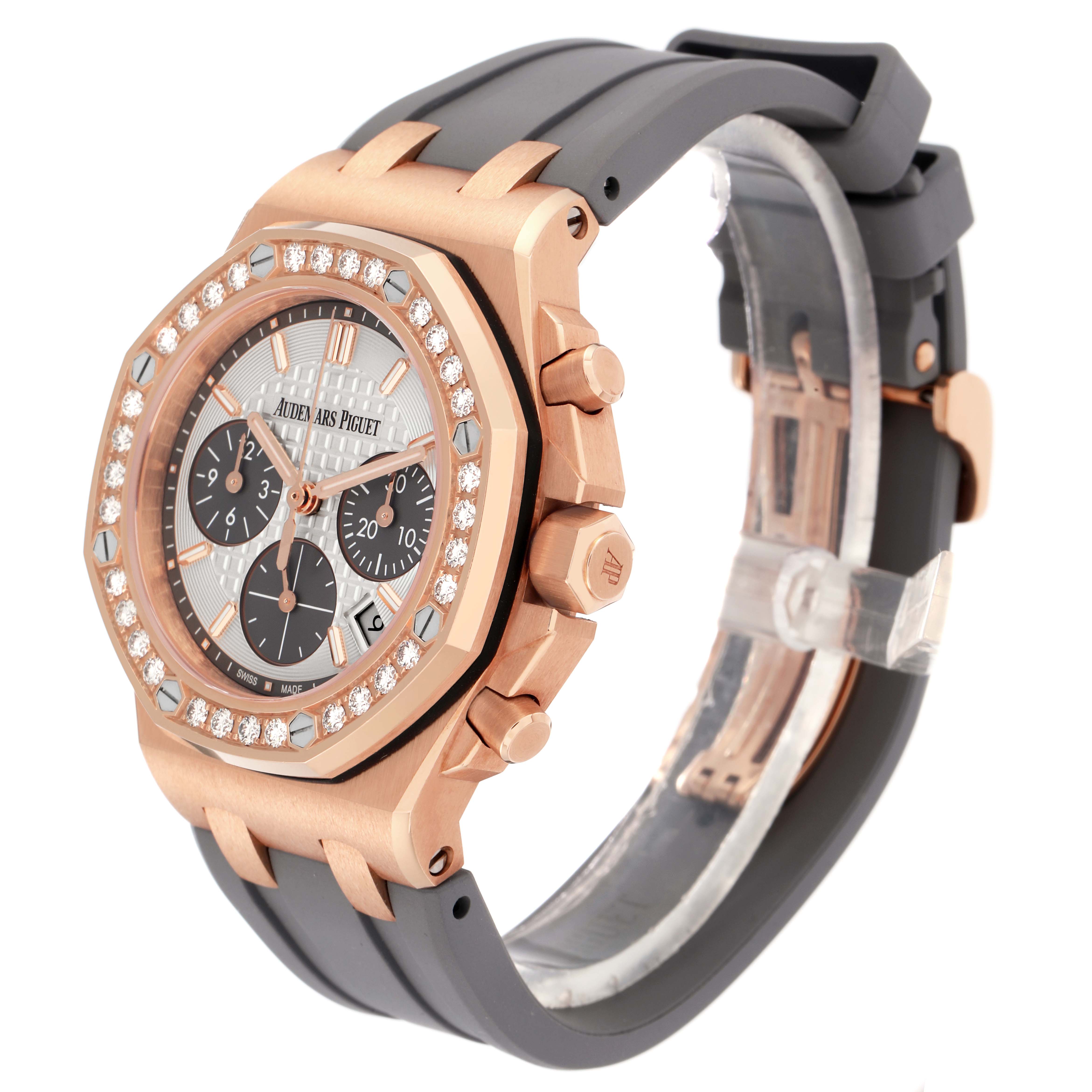 The Audemars Piguet Royal Oak Offshore 26231OR Men
s Rose Gold Silver Dial watch is shown at a three-quarter angle, displaying its rose gold case, diamond bezel, and black rubber strap.
