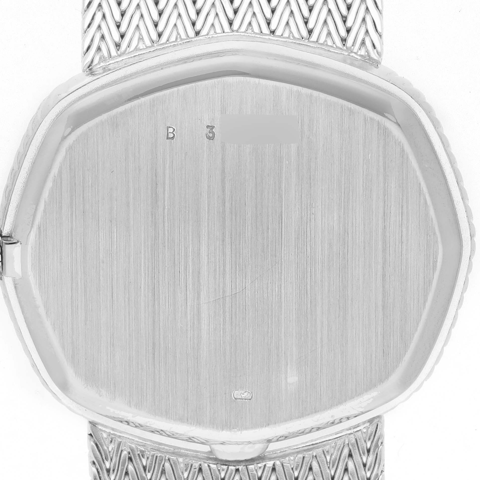 The image shows the back casing and bracelet of a Vintage Audemars Piguet watch, featuring a brushed finish and intricate pattern.