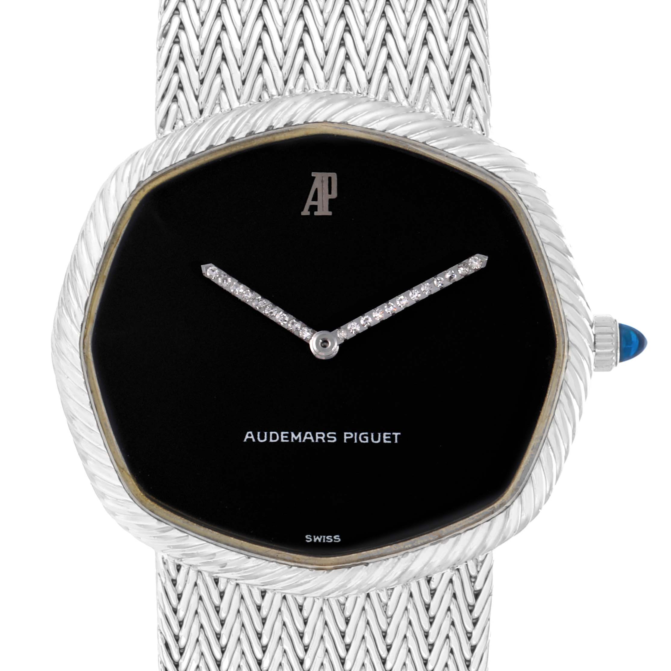 The Audemars Piguet Vintage Women
s White Gold Black Dial watch is shown from a front angle, highlighting the dial, hands, case, crown, and woven bracelet.