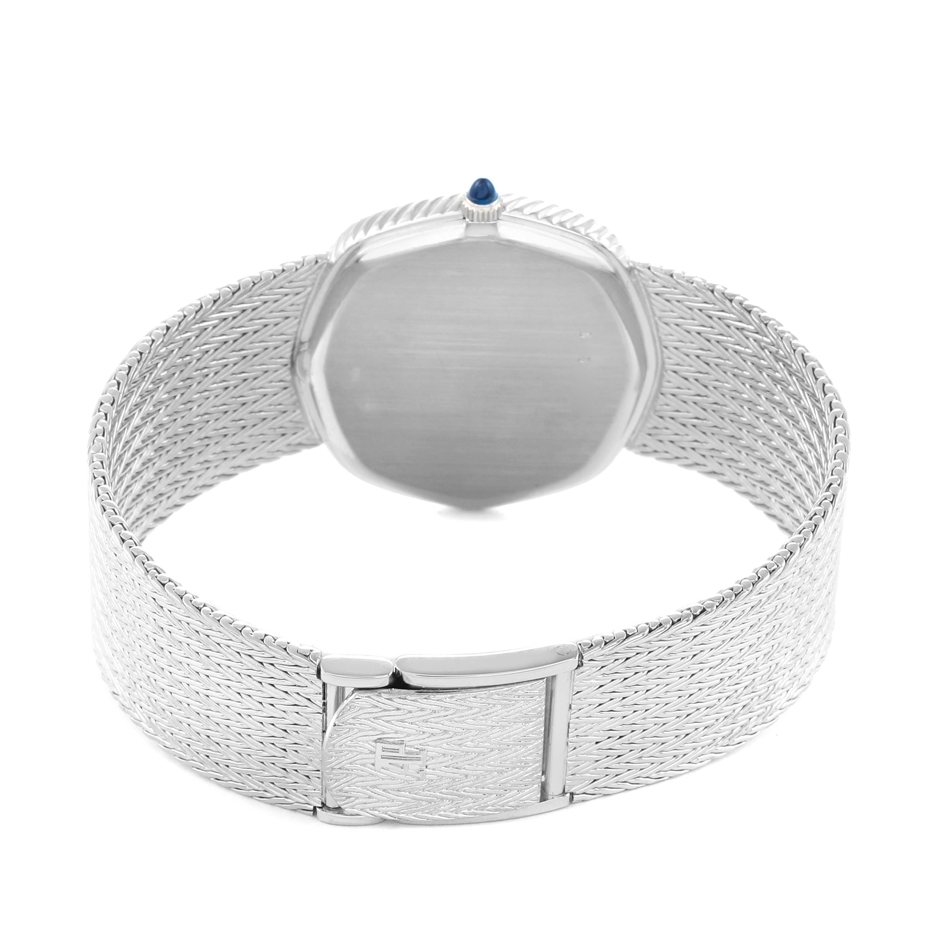 The image shows a rear view of an Audemars Piguet Vintage Women
s White Gold Black Dial watch, highlighting the clasp and textured metal bracelet.