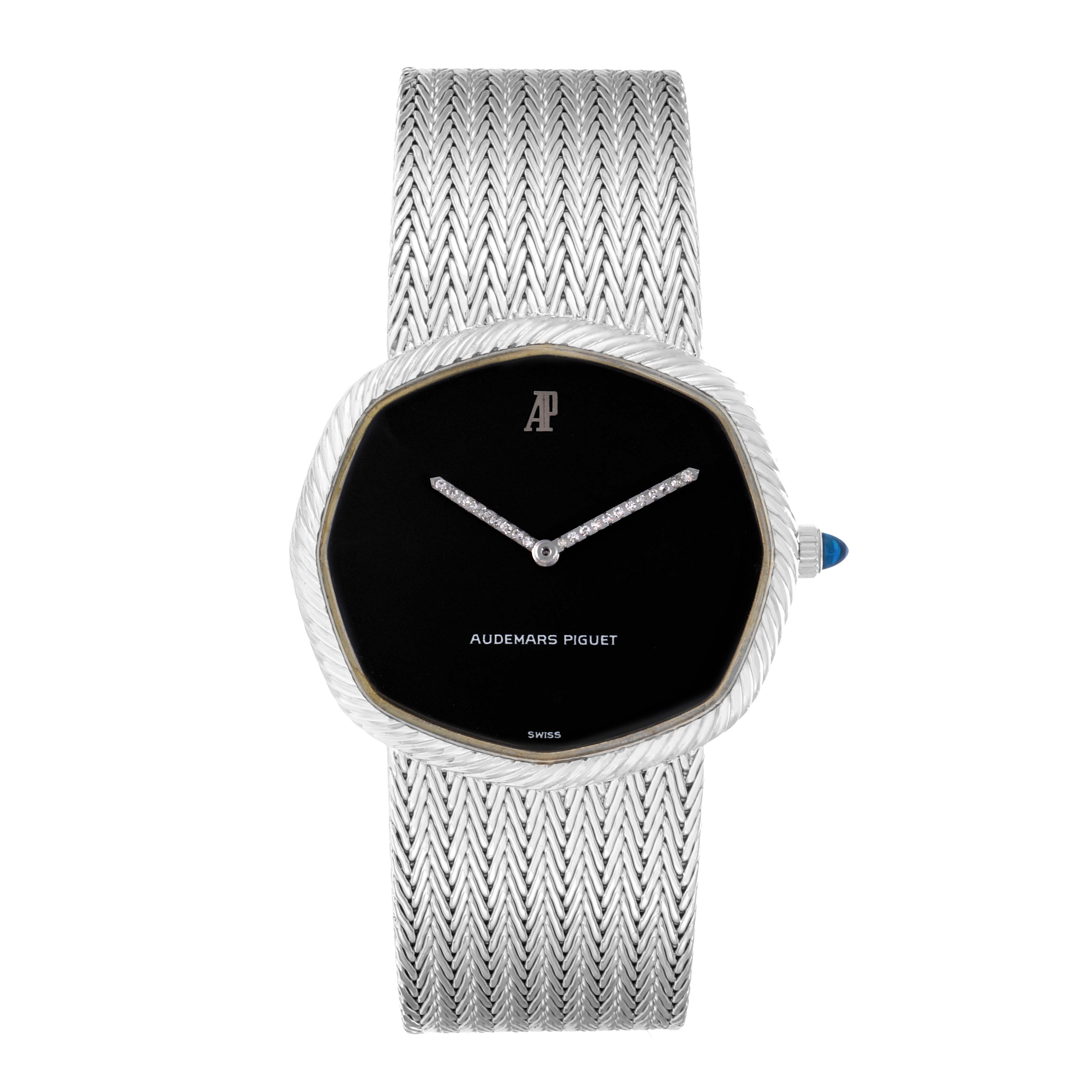 The Audemars Piguet Vintage Women
s White Gold Black Dial watch is shown from the front, displaying the face, bezel, crown, and the textured bracelet.