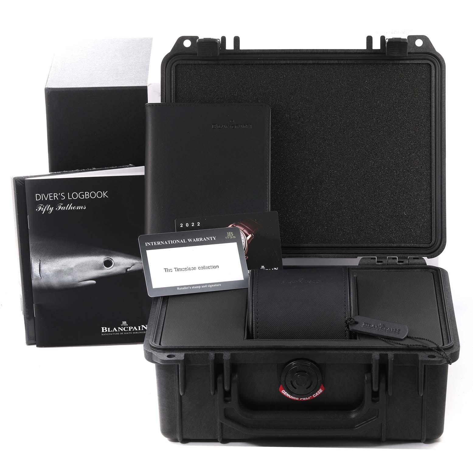 The image shows a diver's logbook, warranty card, case, and other accessories for the Blancpain Fifty Fathoms 5015-1130-71S Men's Stainless Steel Black Dial 5015-1130-71S Men's Stainless Steel Black Dial watch.